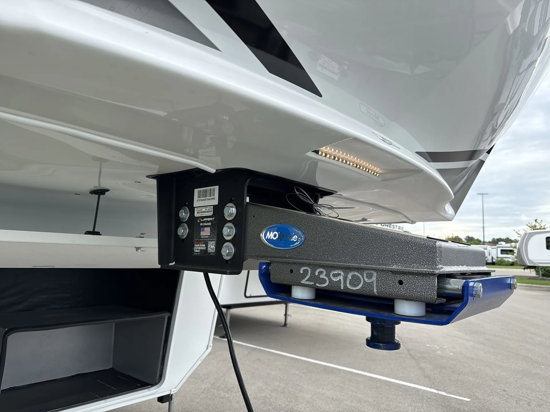 2026 Grand Design Solitude 391DL — Visible exterior fifth-wheel hitch and associated coupling hardware beneath the RV