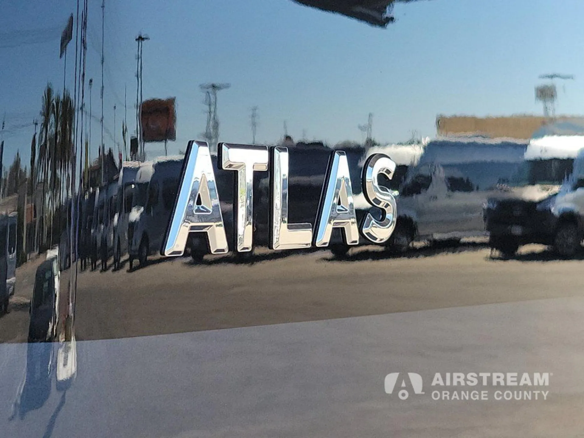 2026 Airstream Atlas Murphy Suite — Close-up photograph of the exterior Atlas badge on the vehicle body
