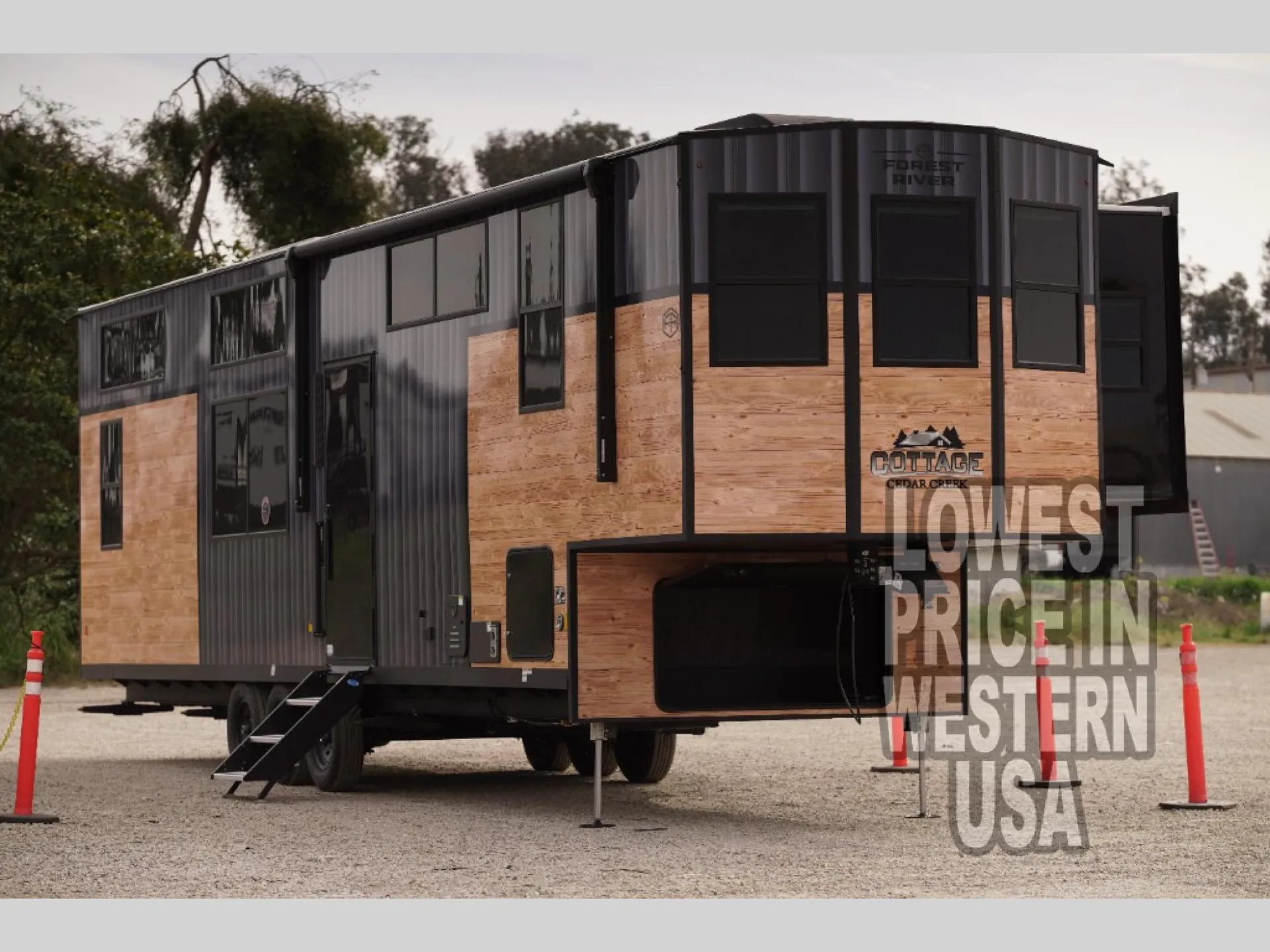 2026 Forest River Cedar Creek Cottage 41FWC — Visible three-quarter photograph of the RV exterior shows siding, windows, entry steps, wheels, and support legs