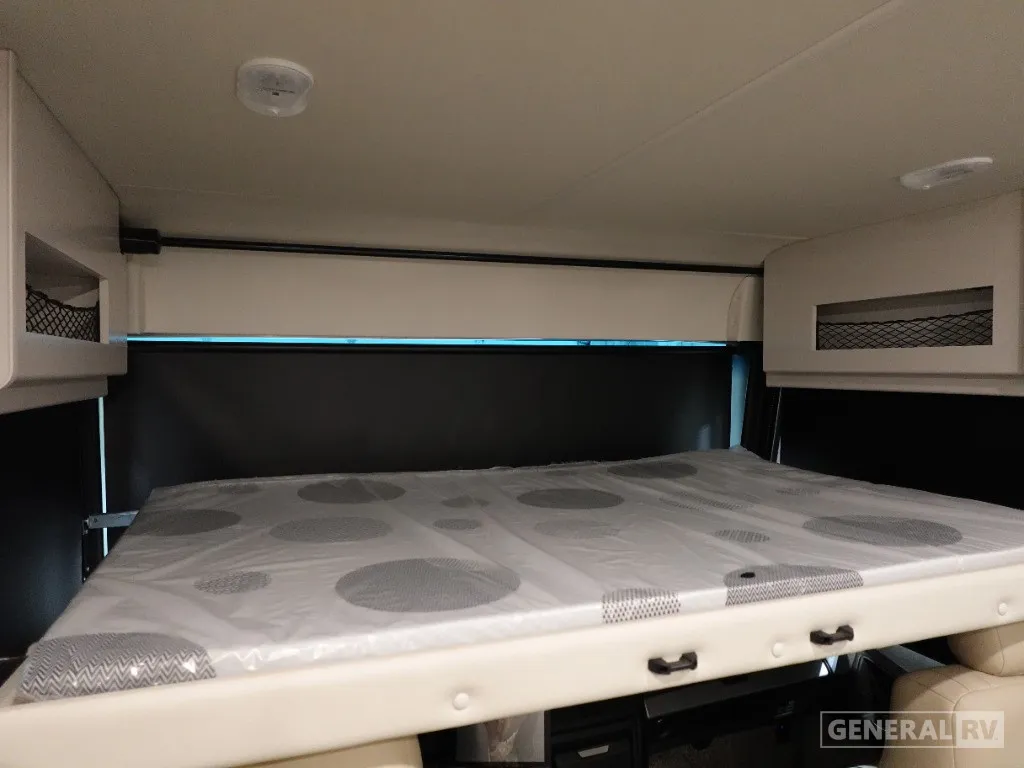 2026 Holiday Rambler Invicta 36Y — Over-cab loft mattress with overhead storage cabinets and window shades