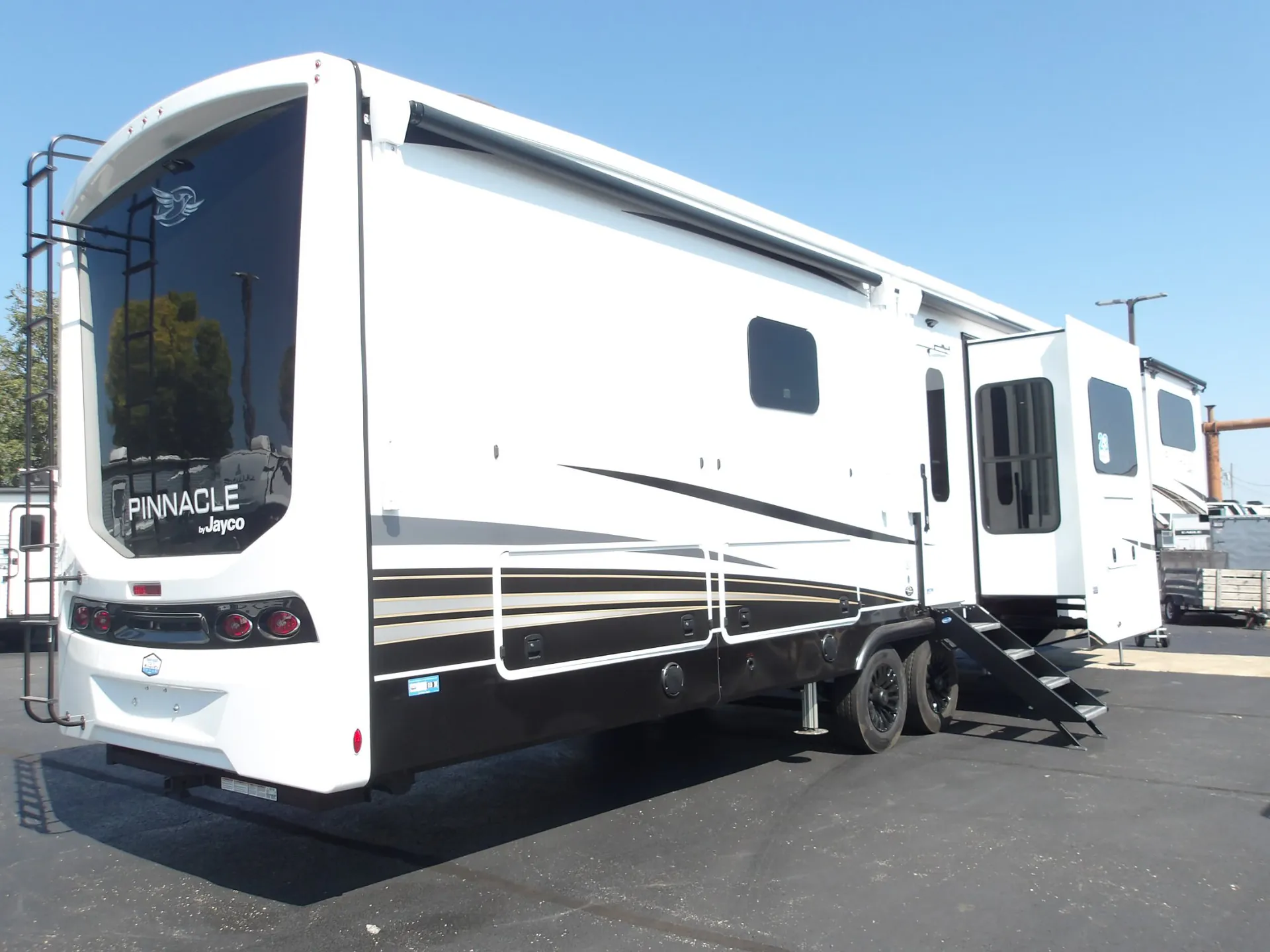 2027 Jayco Pinnacle 39FLOK — The exterior rear and side of the fifth-wheel RV
