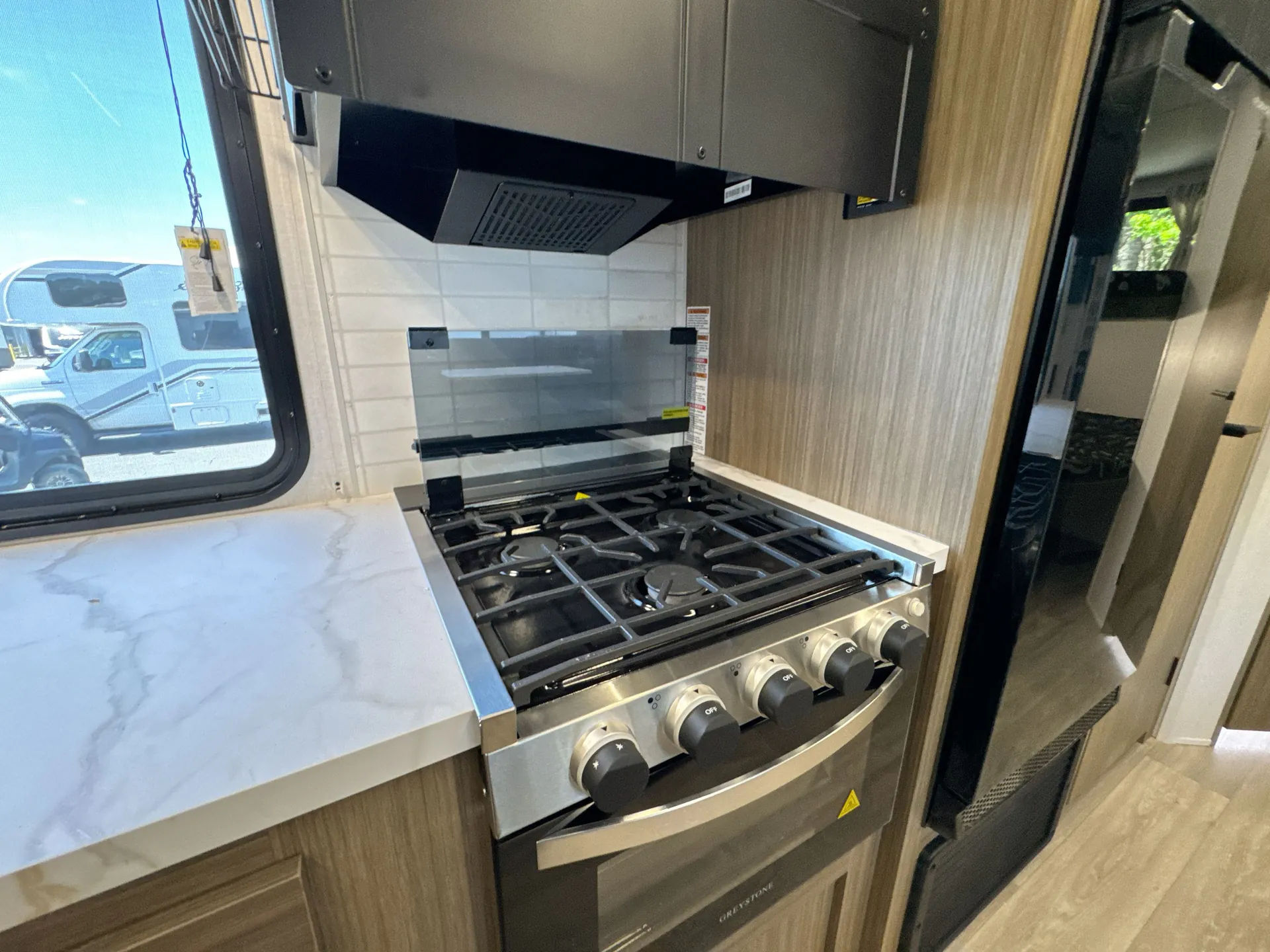 2026 Forest River Wildwood X-Lite 263BHXL — stove oven open