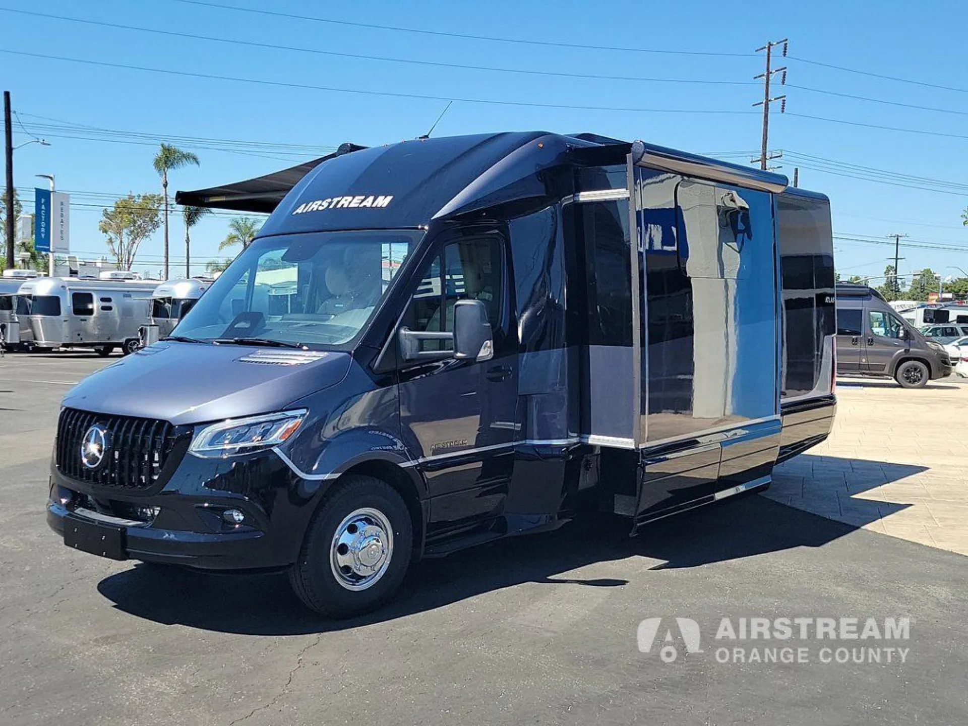 2026 Airstream Atlas Murphy Suite — Three-quarter exterior photograph visibly shows the motorhome shell, awning, and slide-out