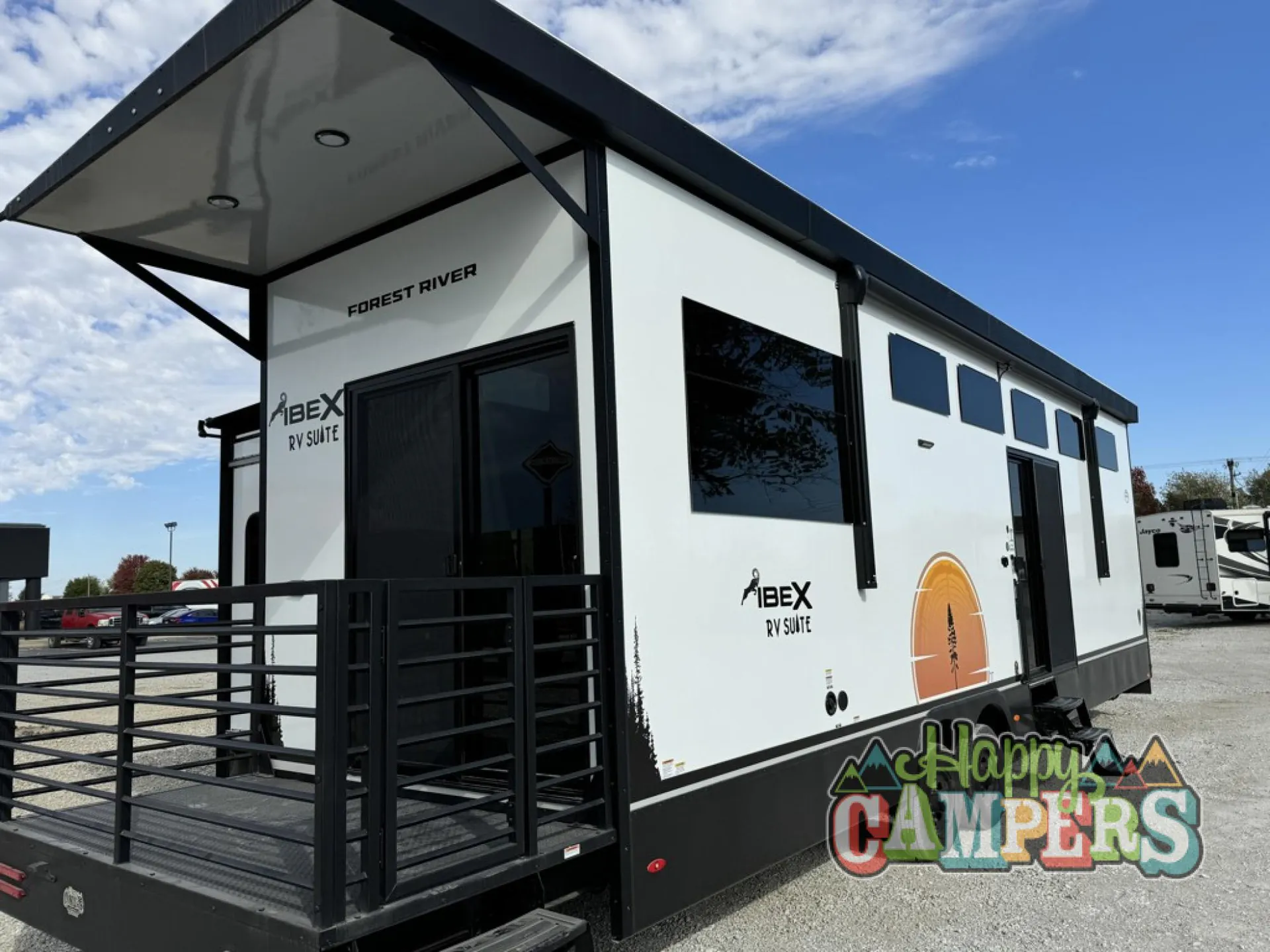 2025 Forest River IBEX RVS3 — Exterior photograph showing the RV shell, entry door, awning, and exterior deck/ramp