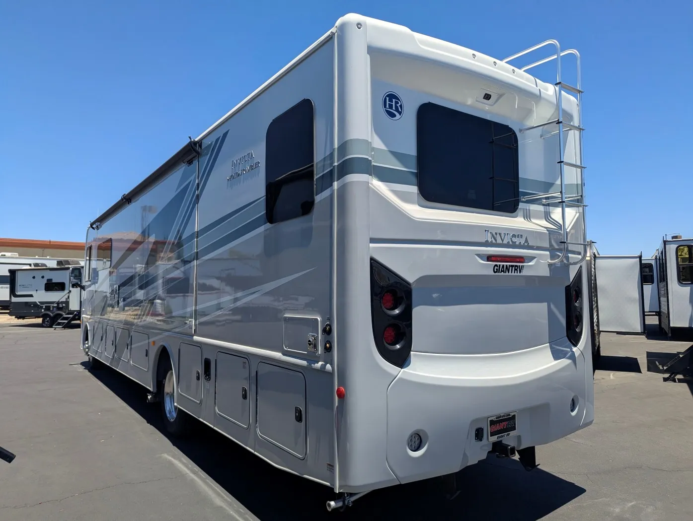 2026 Holiday Rambler Invicta 36Y — Rear three-quarter photograph clearly documents the physical motorhome exterior and rear features