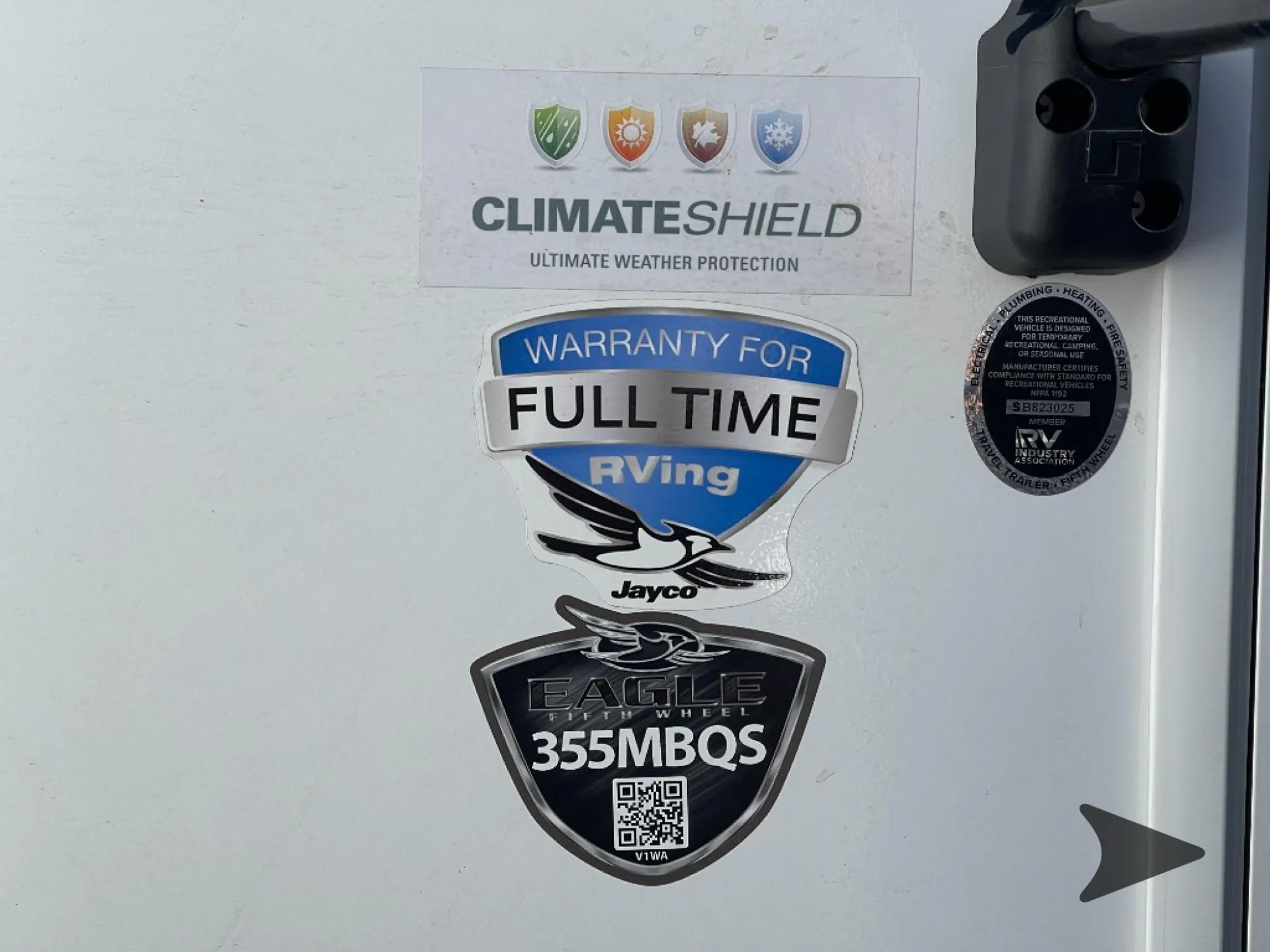 2027 Jayco Eagle 355MBQS — Exterior RV decals and model badges on the trailer wall; no specific functional feature is shown