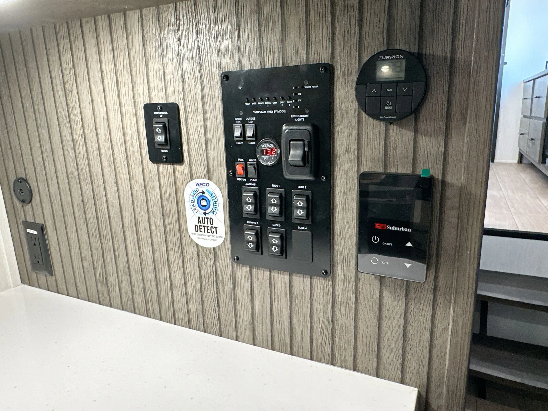 2026 Forest River Arctic Wolf 38LEAH.G — Fifth wheel utility control panel with pump, slide, lighting, voltage, and HVAC controls