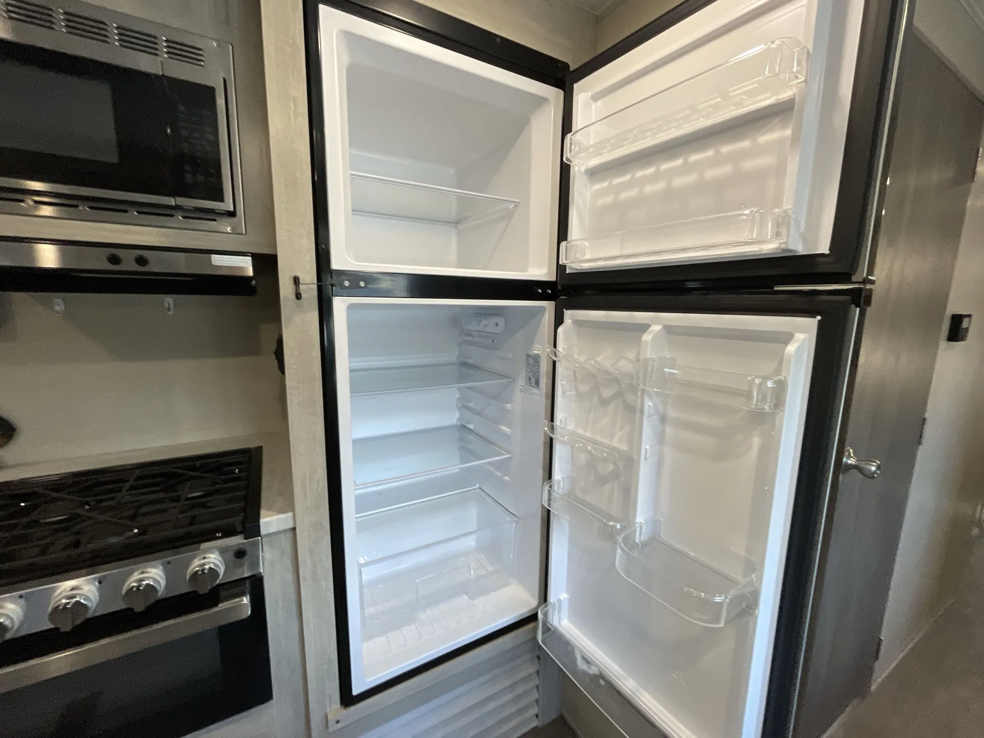 2023 Forest River Aurora 34BHTS — fridge open