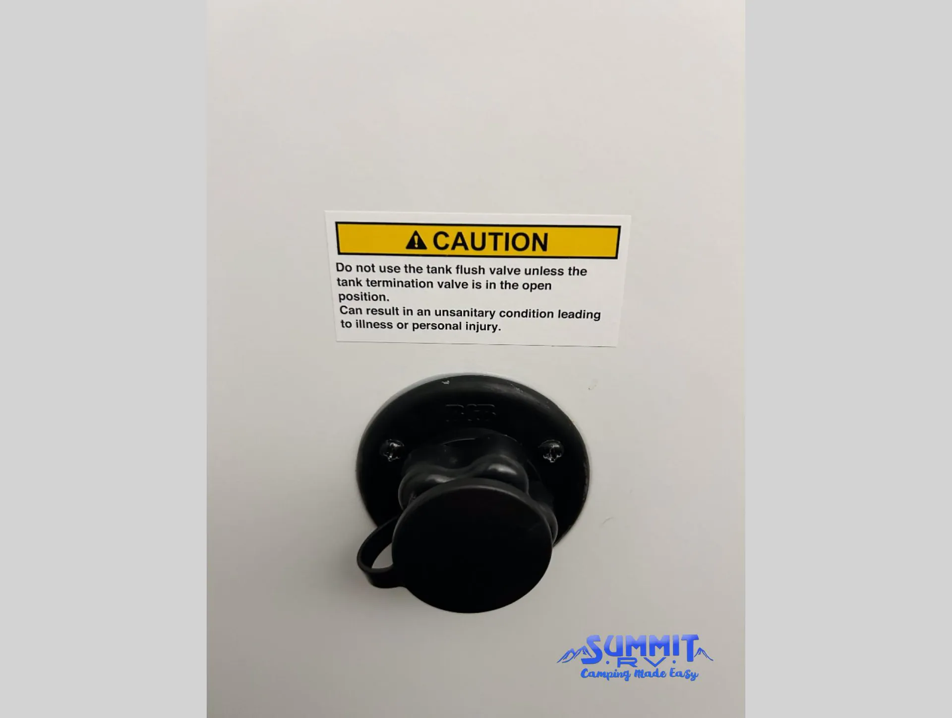 2027 Grand Design Reflection 362TBS — Exterior utility connection with a tank-flush caution label is shown