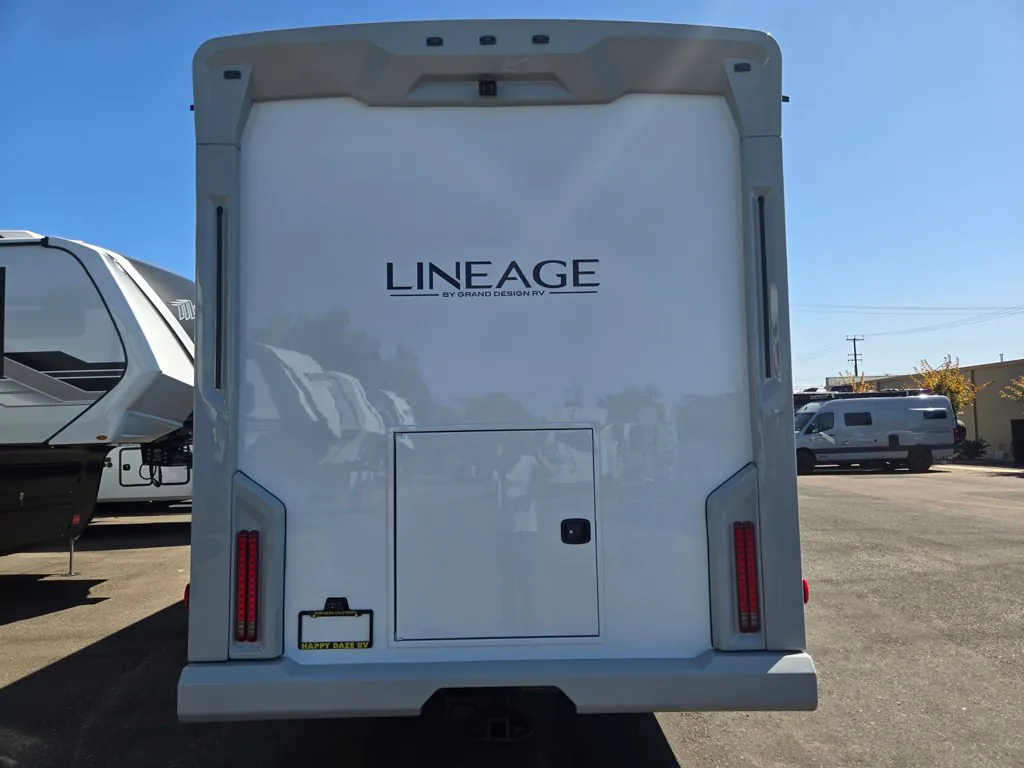 2027 Grand Design Lineage Series F 29AN5 — Rear exterior photograph prominently shows the large exterior storage access door