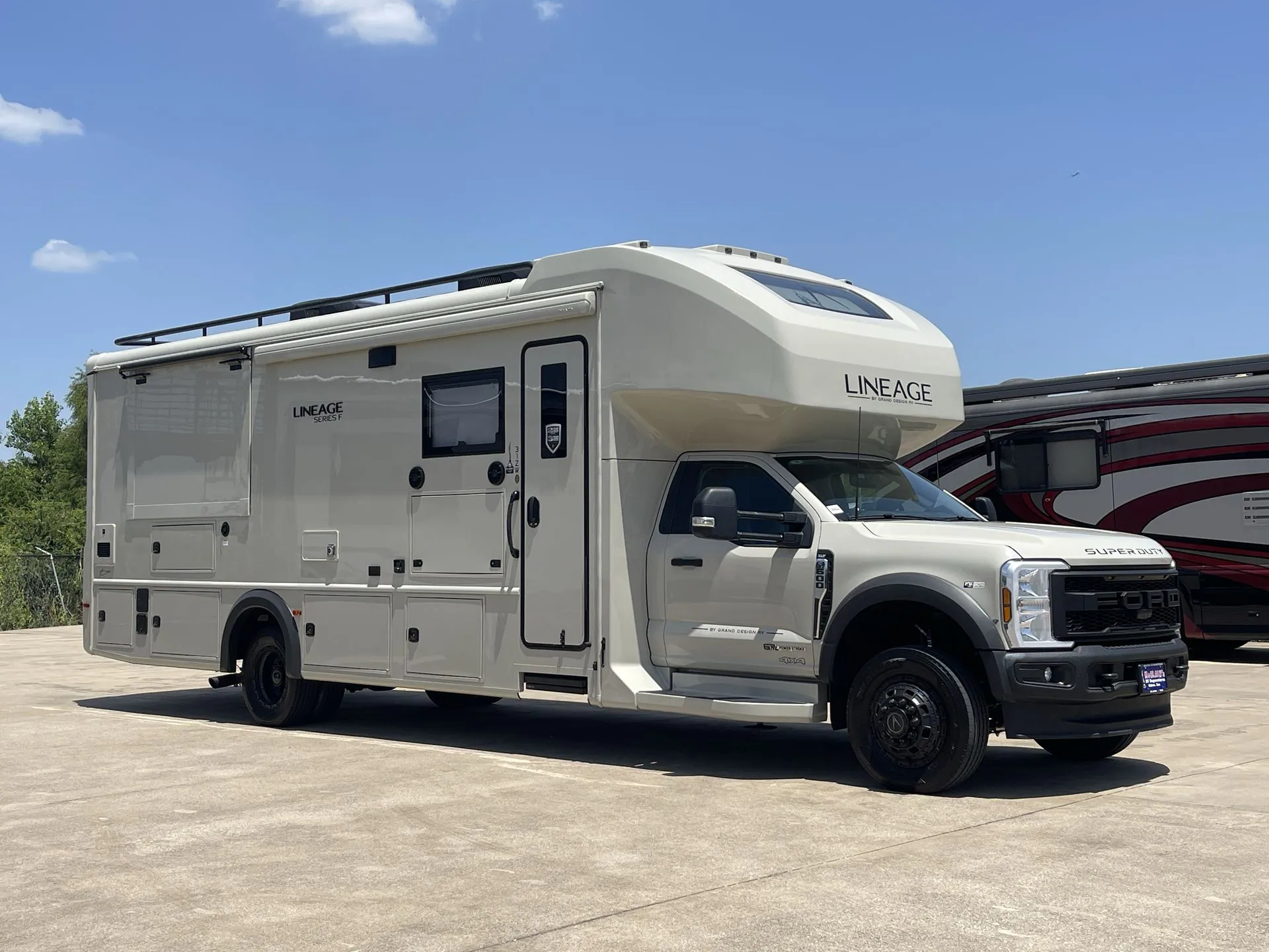2027 Grand Design Lineage Series F 31ZW — The complete Lineage motorhome from outside, including its cab, RV body, wheels, awning, and exterior compartments