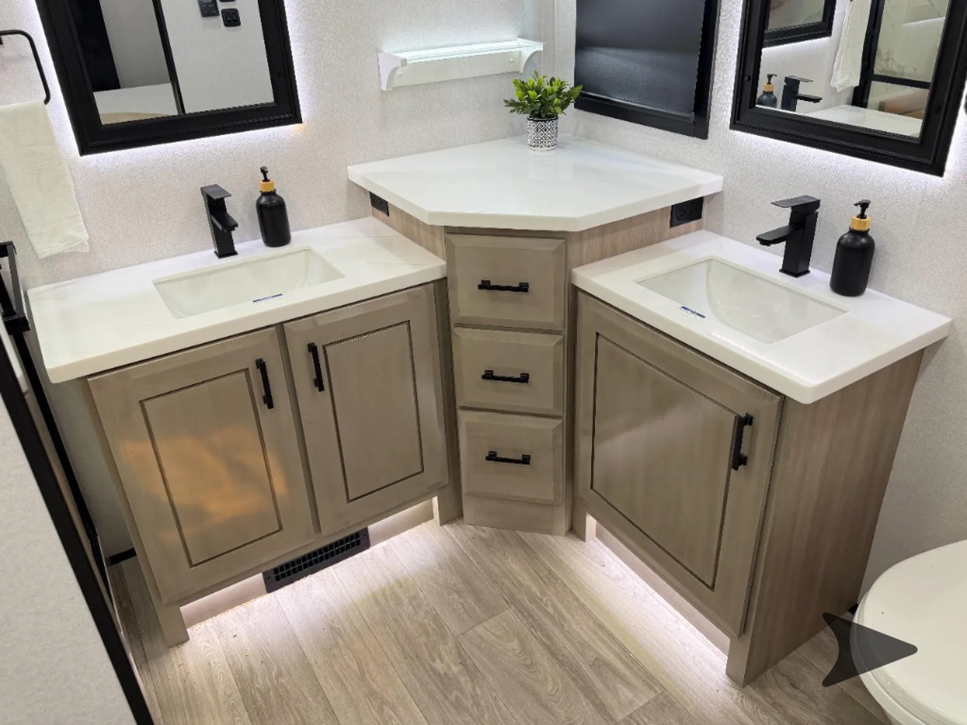 2027 Jayco Pinnacle 39FLOK — Fifth-wheel bathroom vanity with two sinks, black faucets, illuminated mirrors, drawers, and cabinetry