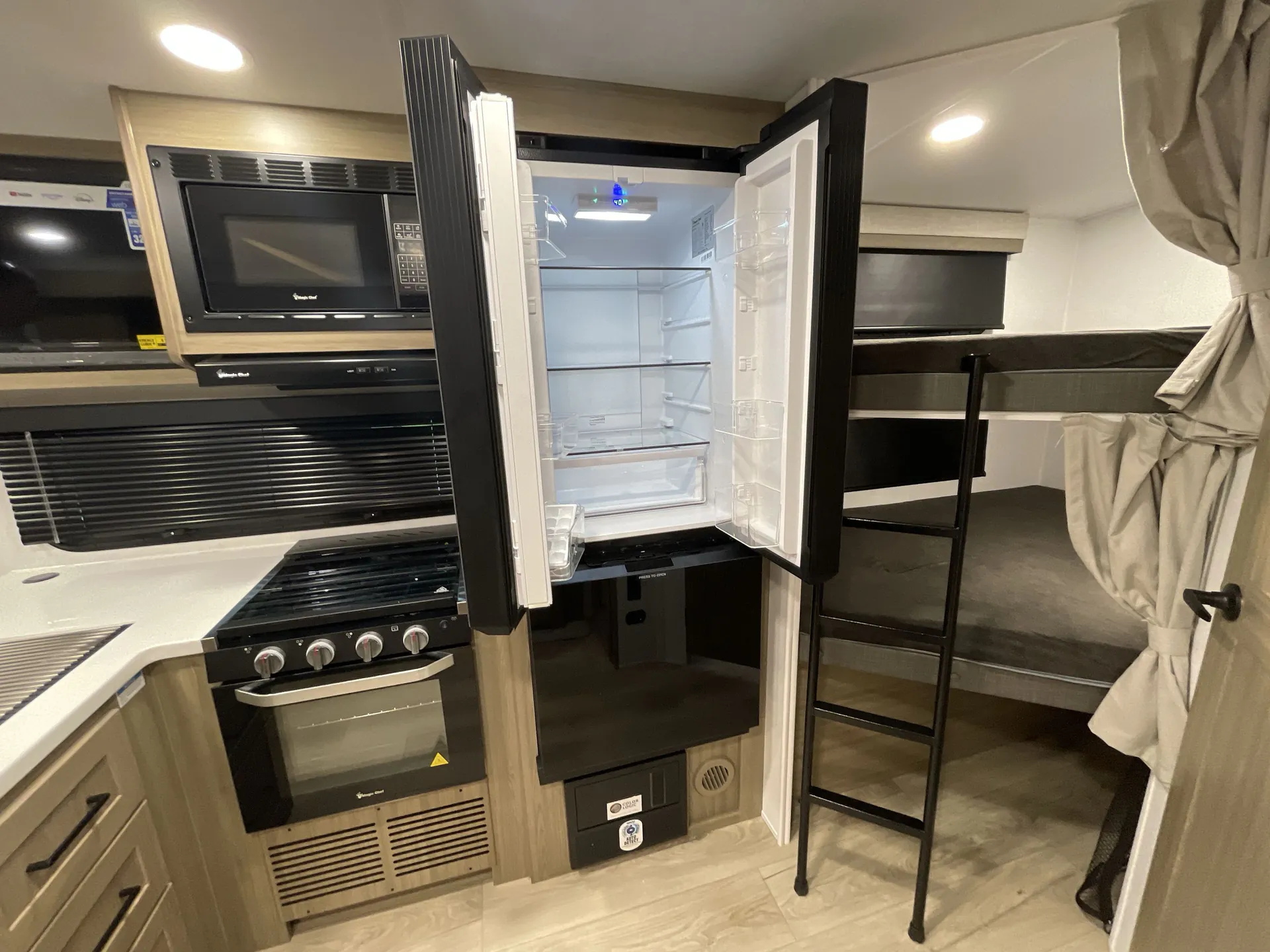 2027 Forest River Flagstaff Micro Lite 25BRDS — fridge open