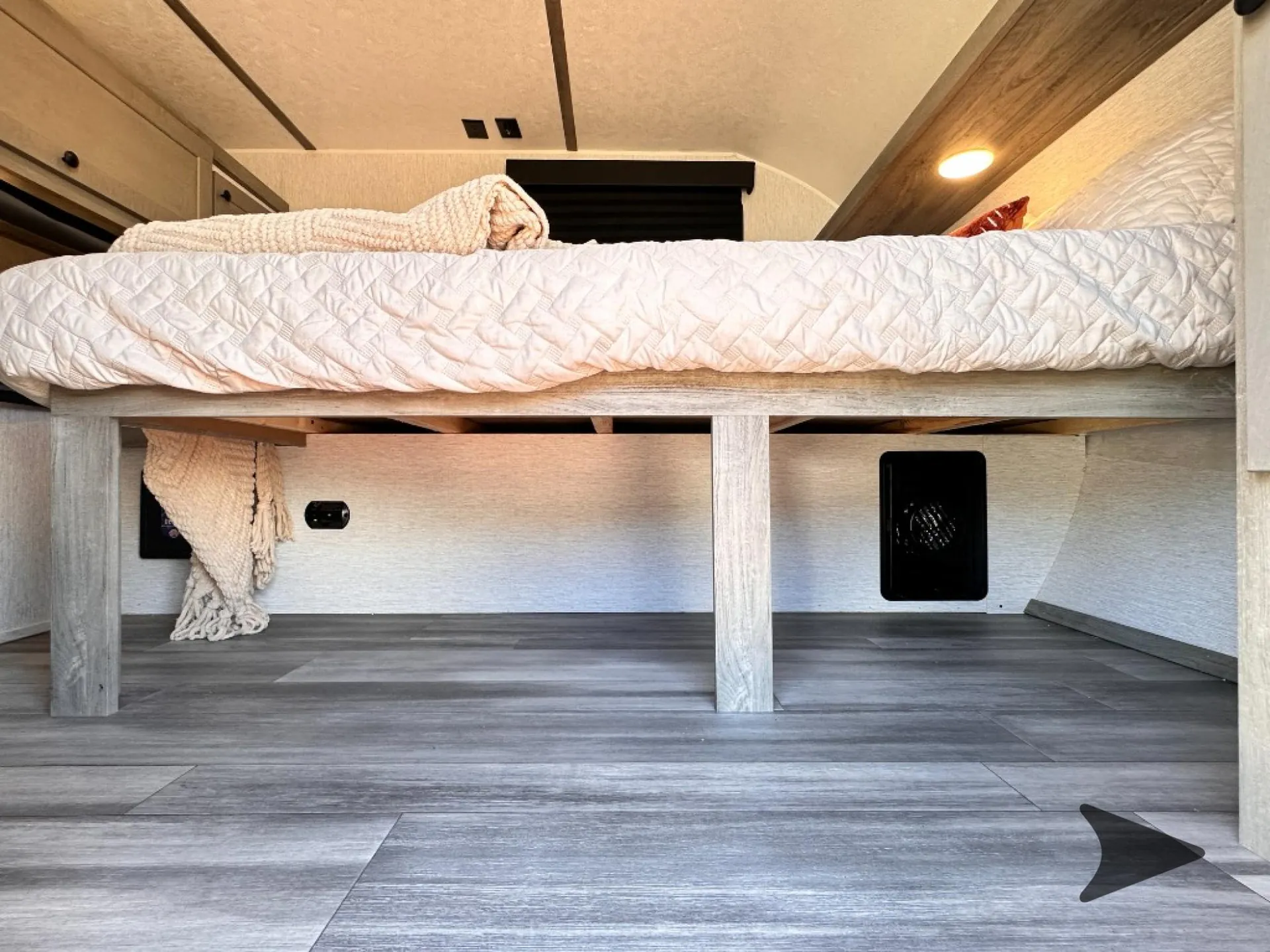 2026 Wayfinder GO LITE LTD Solo — Pop-up camper sleeping area with a mattress above open under-bed storage and built-in wall vents
