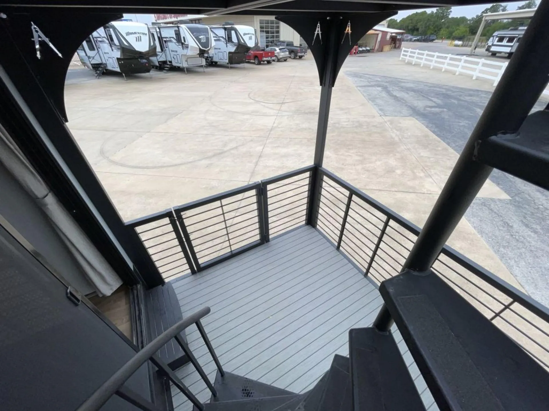 2026 Grand Design Foundation 42GD — View looking down onto the attached outdoor deck and exterior staircase