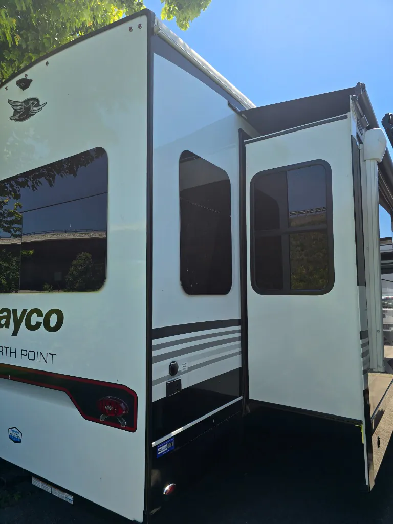 2026 Jayco North Point 377RLBH — Rear exterior of the fifth-wheel with slide-outs and exterior body panels visibly shown