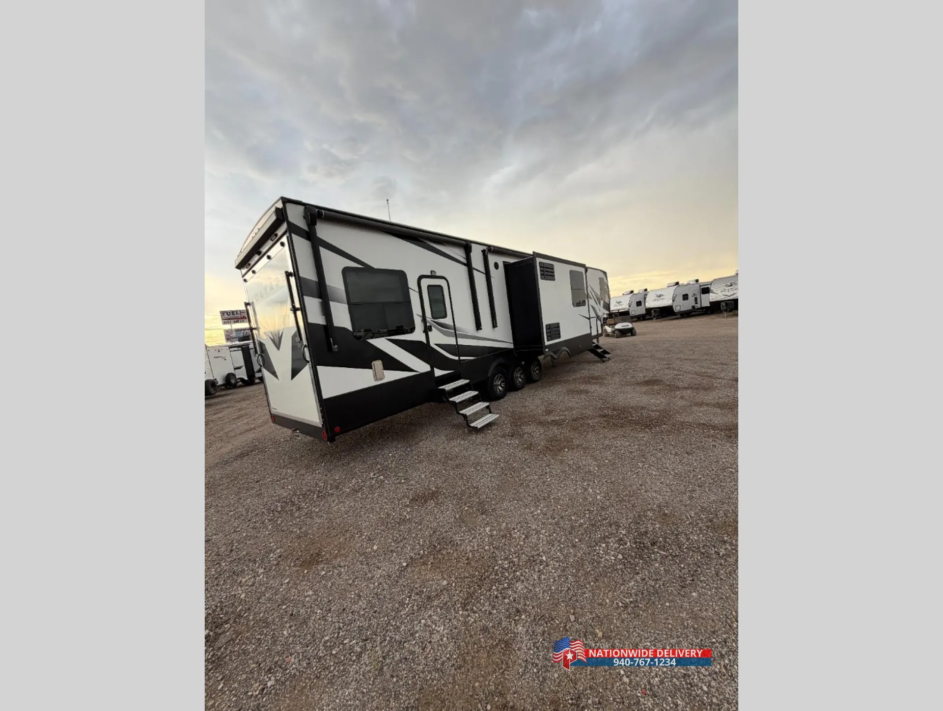 2022 Dutchmen Voltage 4225 — The RV's exterior rear-side corner, windows, slide-out, wheels, and entry steps