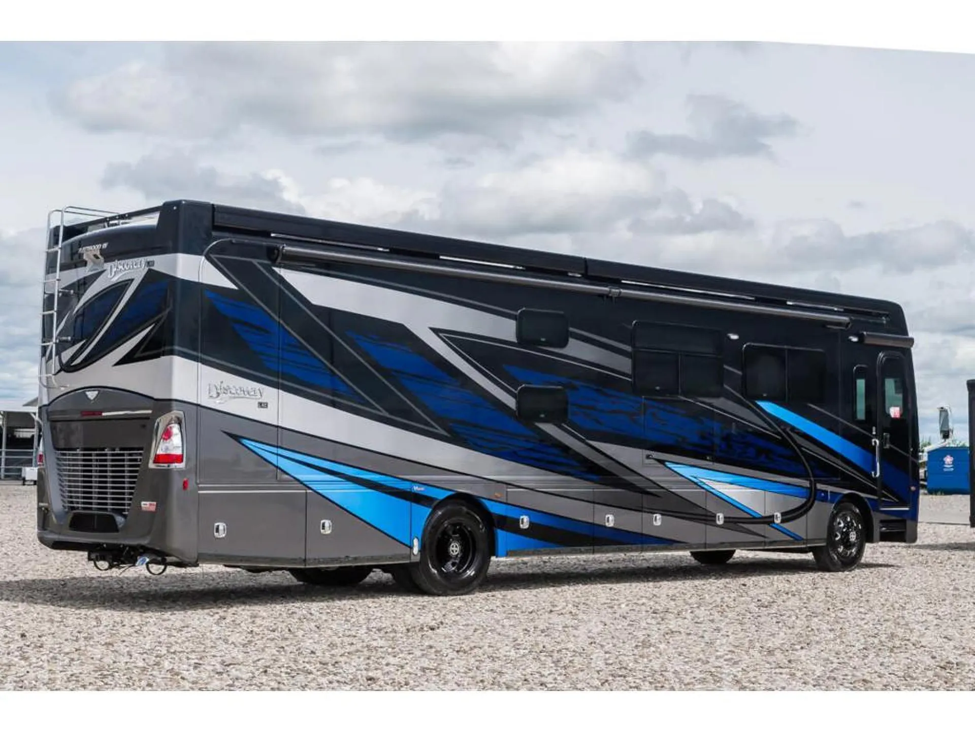 2026 Fleetwood Discovery LXE 40G — The complete exterior side and rear of the motorhome