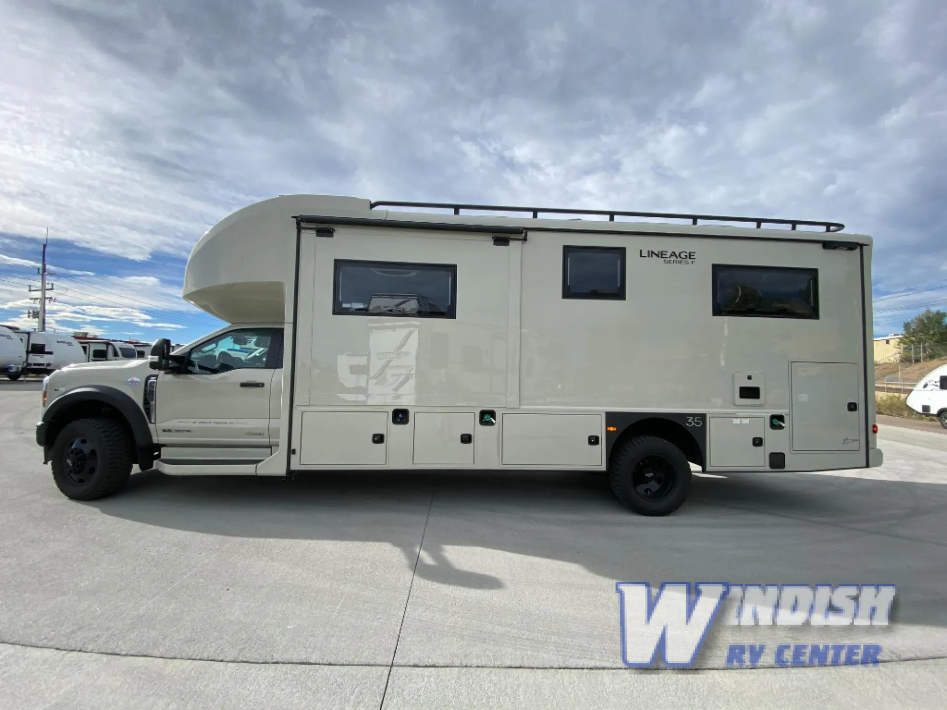 2027 Grand Design Lineage Series F 29AN5 — Side-profile photograph visibly shows the RV exterior shell, windows, wheels, and exterior access panels
