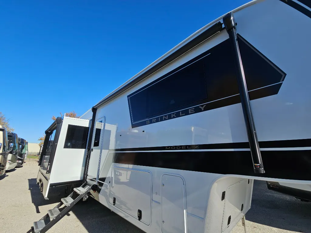 2026 Brinkley Model Z 3515 — Shows the RV exterior side, awning, slide-out, branding, and exterior compartments