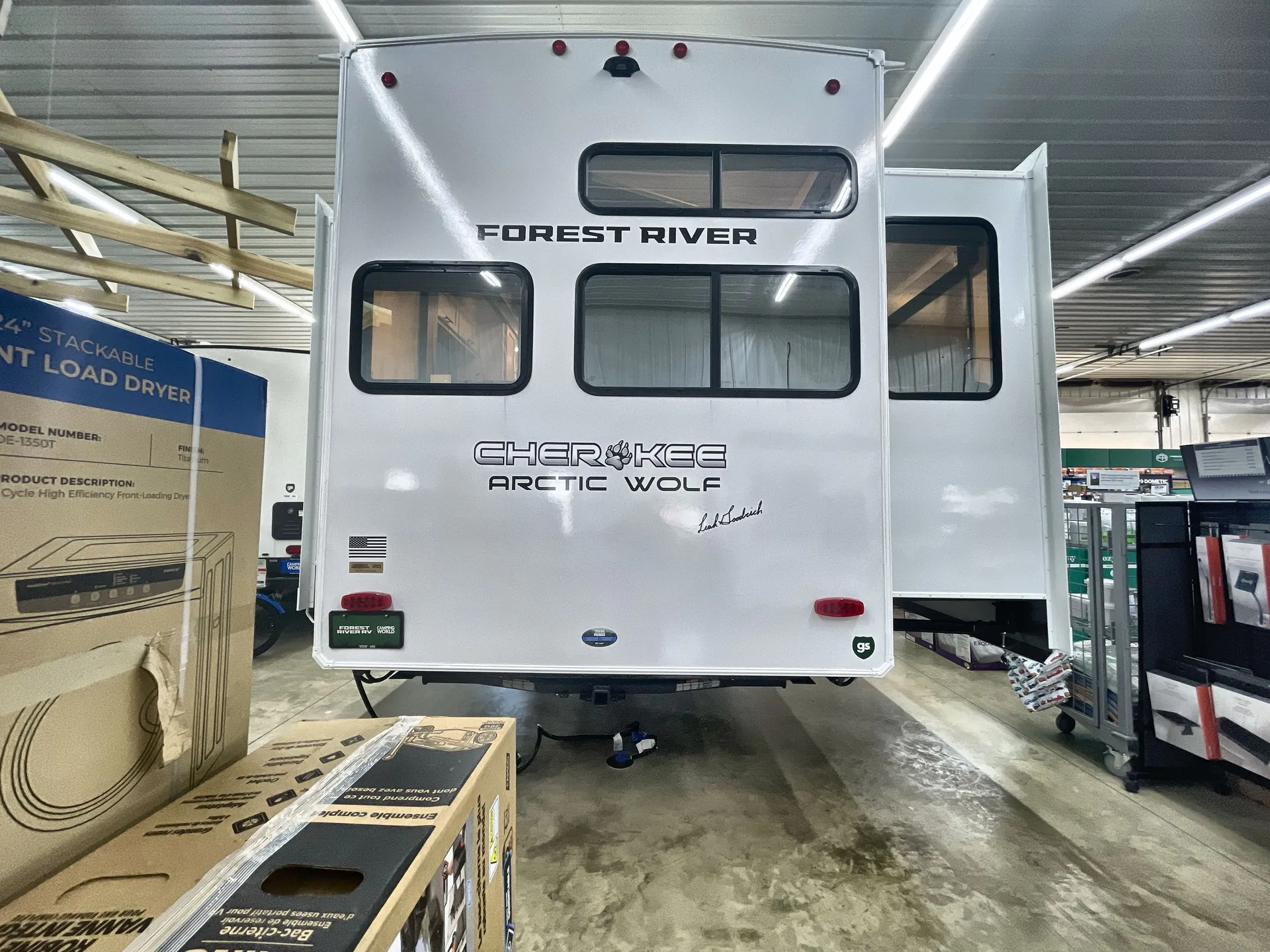 2026 Forest River Arctic Wolf 38LEAH.G — Rear exterior of the travel trailer/fifth-wheel with rear wall, windows, lights, decals, and bumper area visible