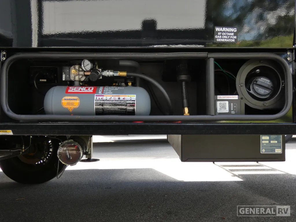2026 Brinkley Model G 3250 — Exterior service-compartment photograph visibly shows a generator fuel connection, regulator, tank, and labeled mechanical equipment