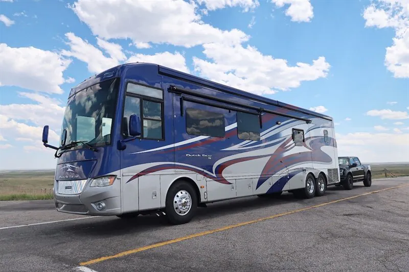 2016 Newmar Dutch Star 4369 — The motorhome's front and side exterior with windows, wheels, and exterior body