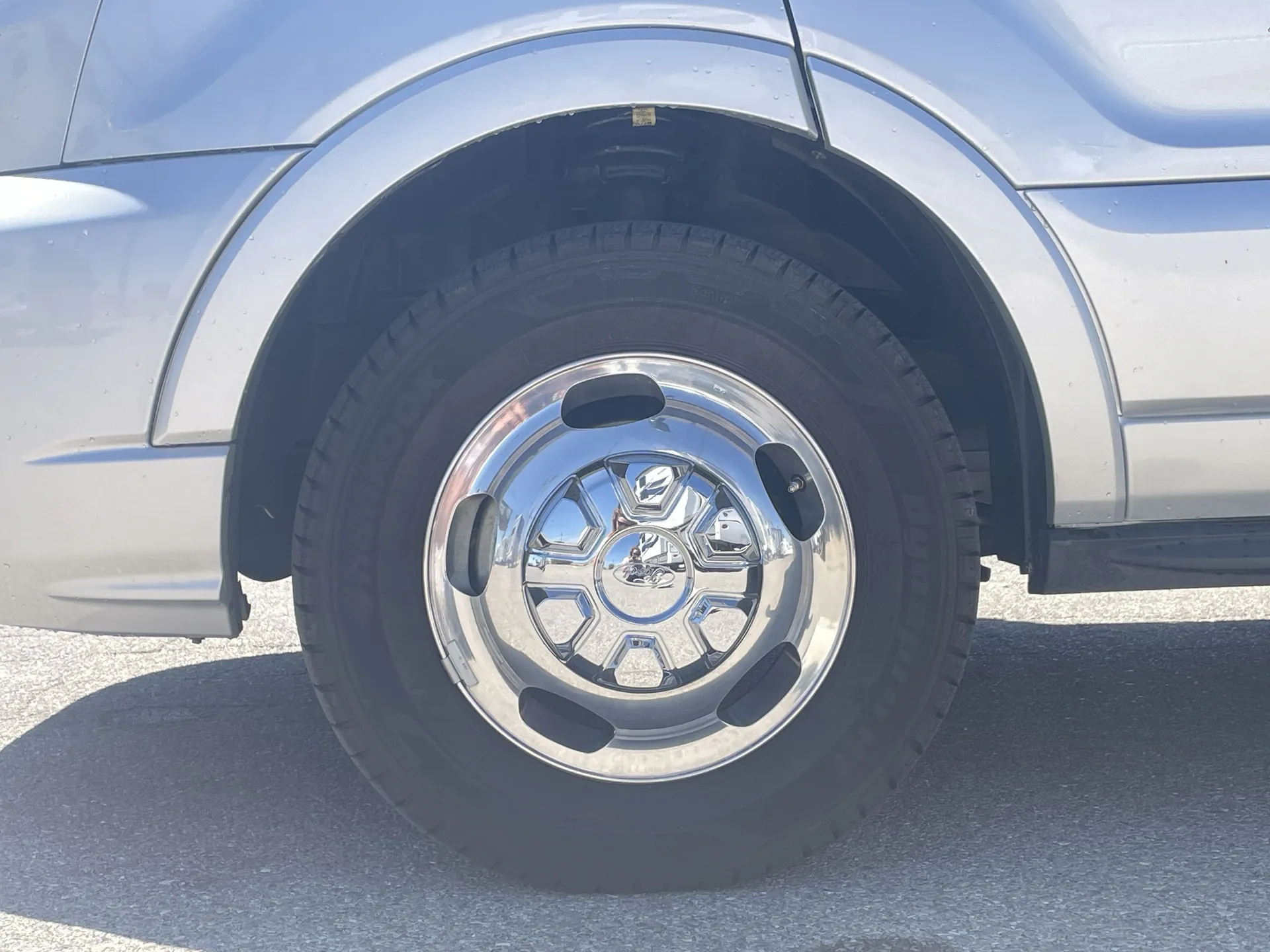 2024 Chinook RV Maverick SS — Exterior photograph visibly focuses on the RV wheel, tire, wheel arch, and body panel