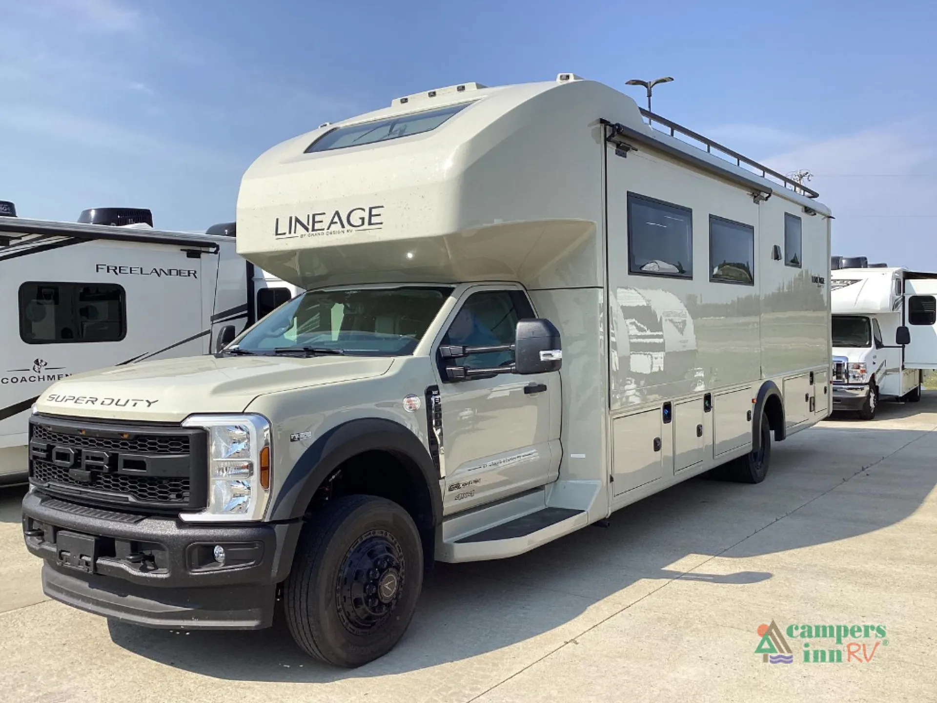 2027 Grand Design Lineage Series F 31ZW — Three-quarter exterior photograph visibly shows the RV shell, cab, windows, awning, wheel, and exterior storage doors