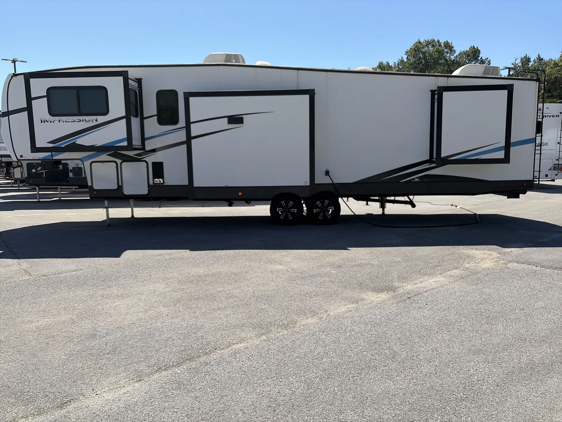 2023 Forest River Impression 320FL — off campside