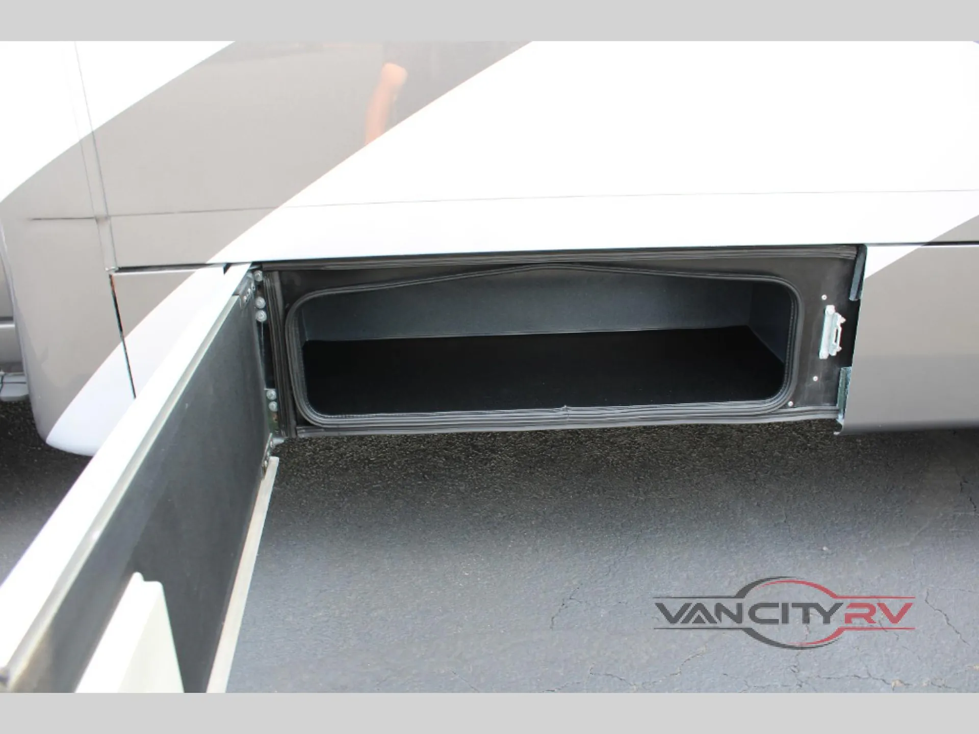 2025 Chinook RV Maverick SS — Exterior-installed open storage compartment is visibly shown beneath the RV body