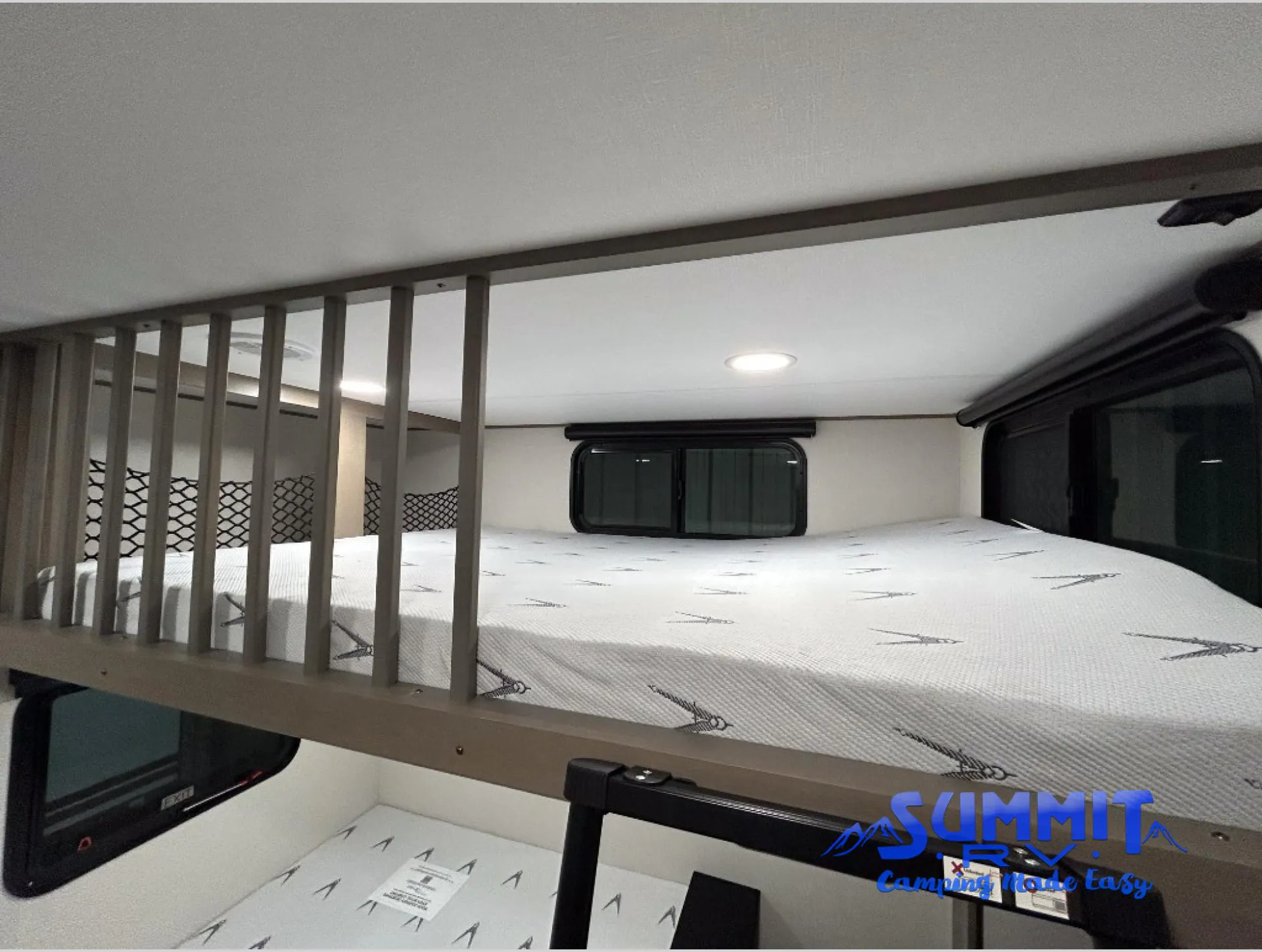 2027 Grand Design Reflection 362TBS — Elevated loft mattress with guardrail and ladder above a second mattress in the bedroom