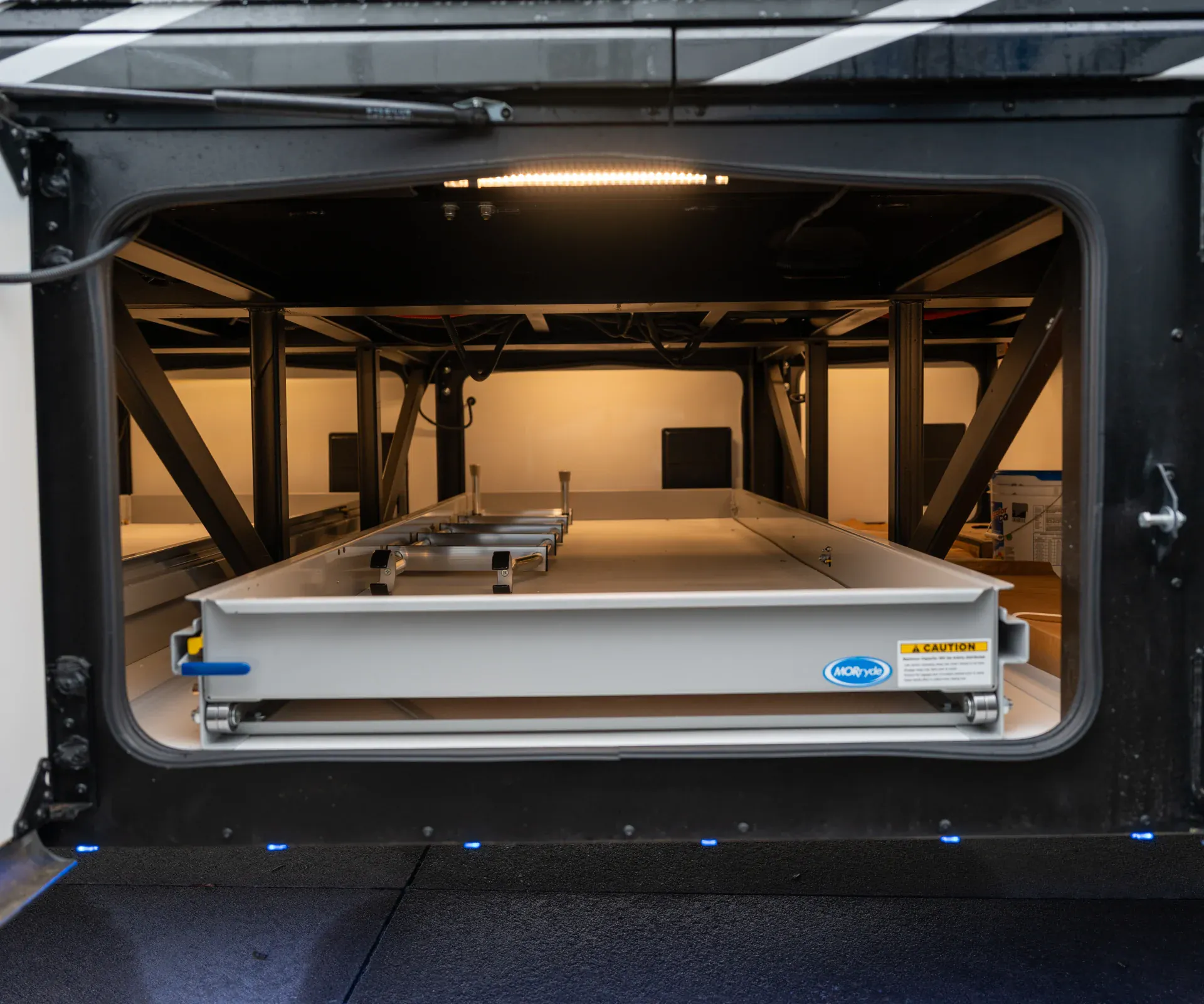 2026 Fleetwood Discovery LXE 40G — Exterior cargo bay visibly shows a large slide-out storage tray and framing