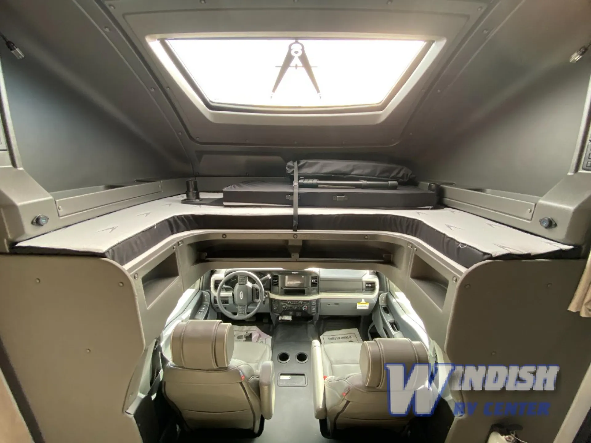 2027 Grand Design Lineage Series F 29AN5 — Over-cab sleeping platform above the Class C cockpit, with mattress and roof skylight visible