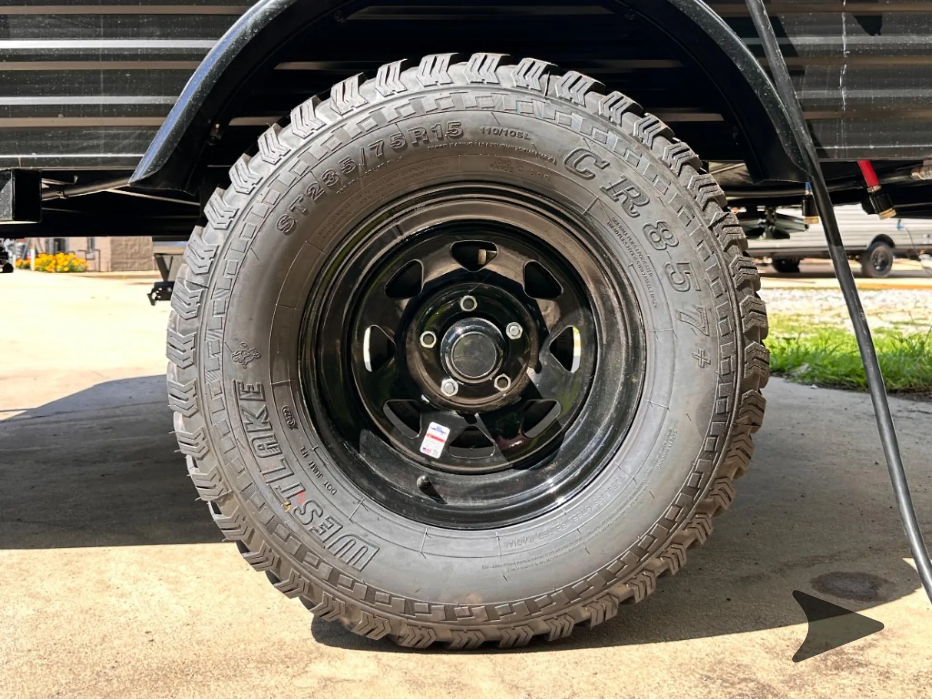 2026 Wayfinder Go Lite Solo — Photograph primarily showing the RV exterior wheel and tire assembly