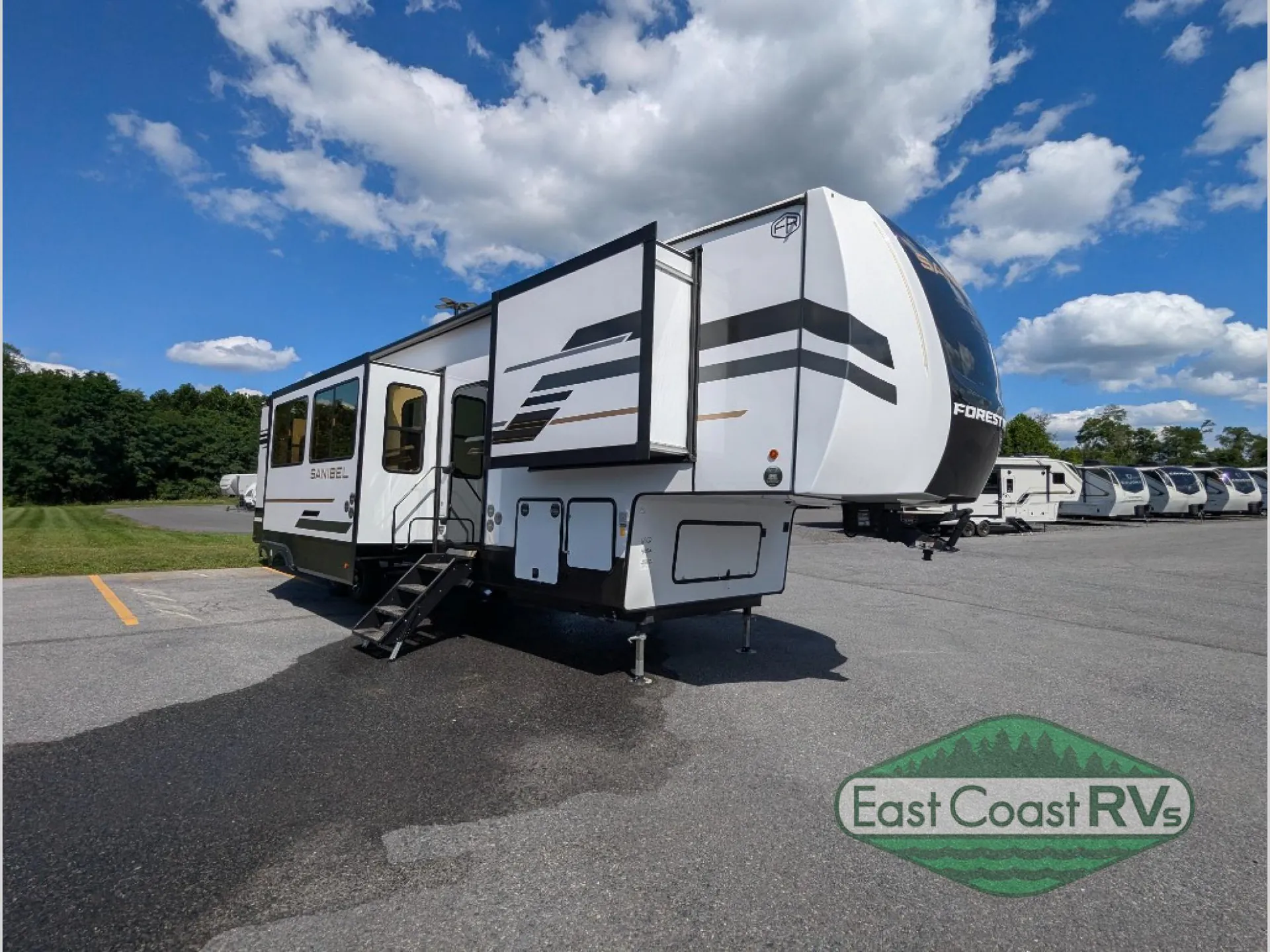 2027 Forest River Sanibel 40BUNK — The exterior front and side of a fifth-wheel RV with slide-outs, hitch, steps, and leveling supports
