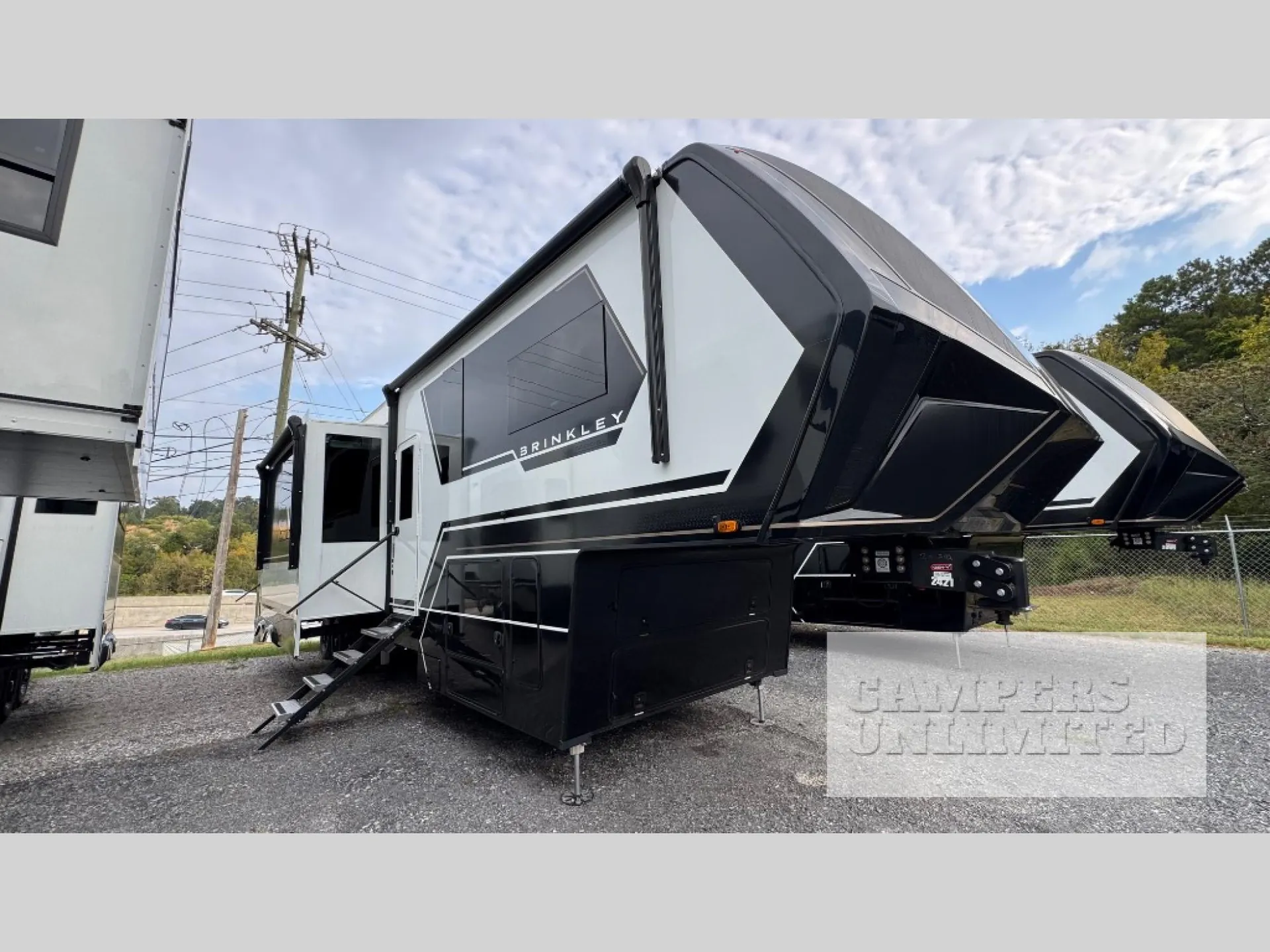 2026 Brinkley Model G 3950 — Exterior photograph visibly shows the fifth-wheel RV from the side/front, including slide-outs, awning, hitch, and body shell