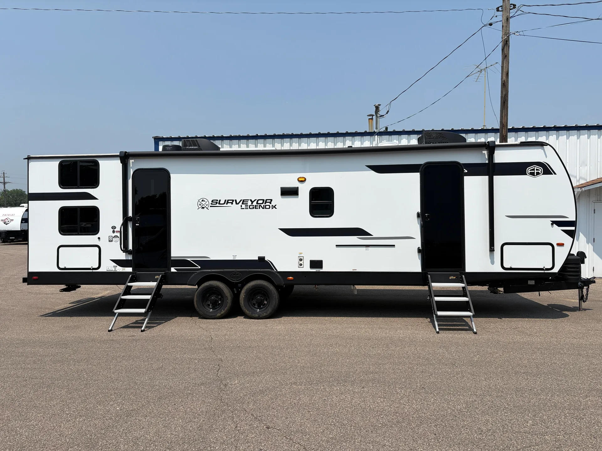 2025 Forest River Surveyor Legend X 29CAMP dealer photo 2 from A.C. Nelsen RV World