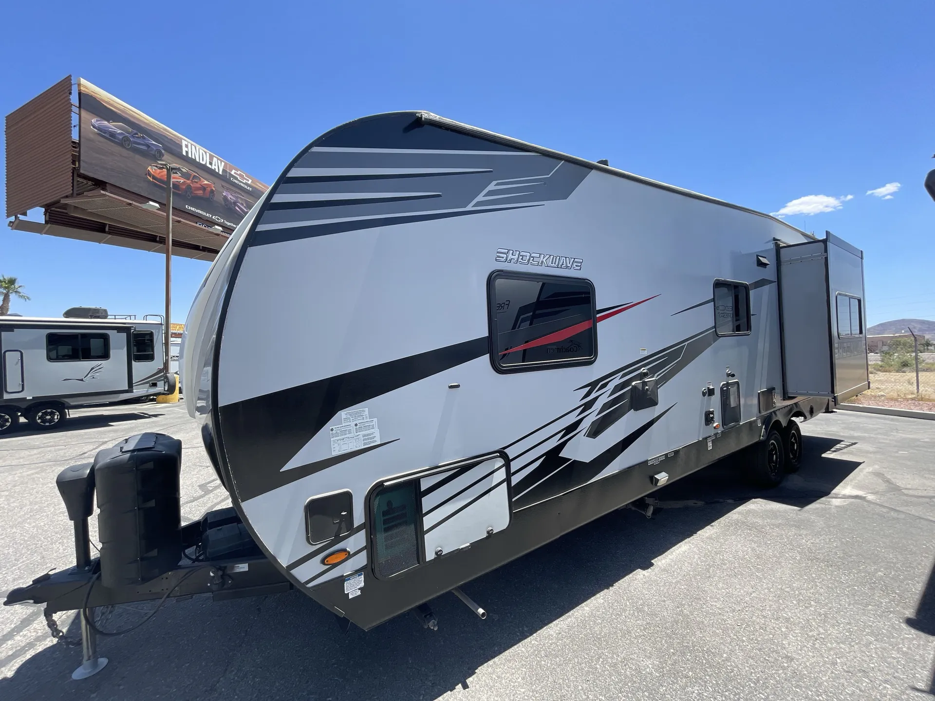 2021 Forest River Shockwave 27RQGDX — off campside