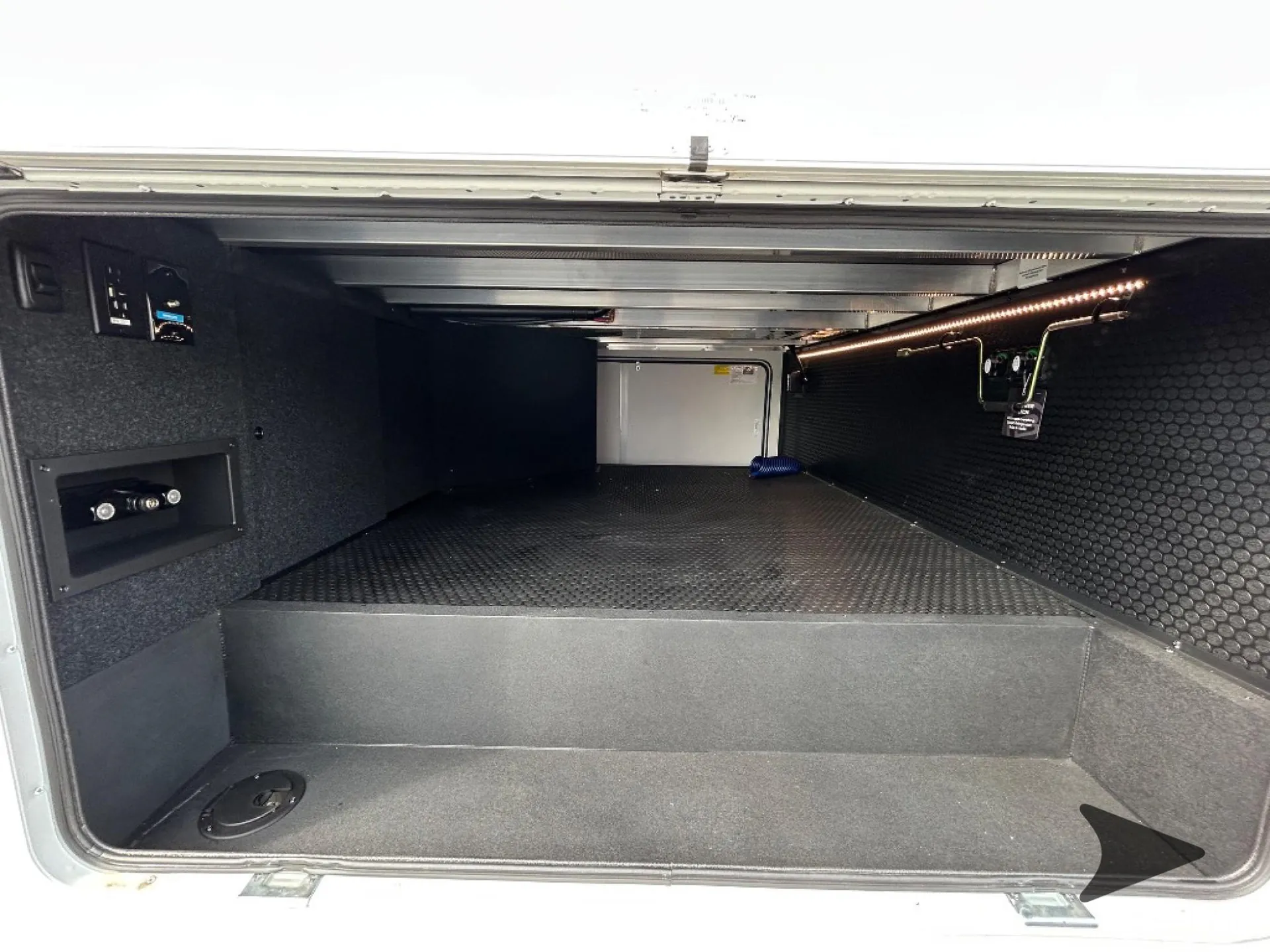 2026 Brinkley Model Z 3515 — Wide photograph visibly shows a large open exterior pass-through storage compartment