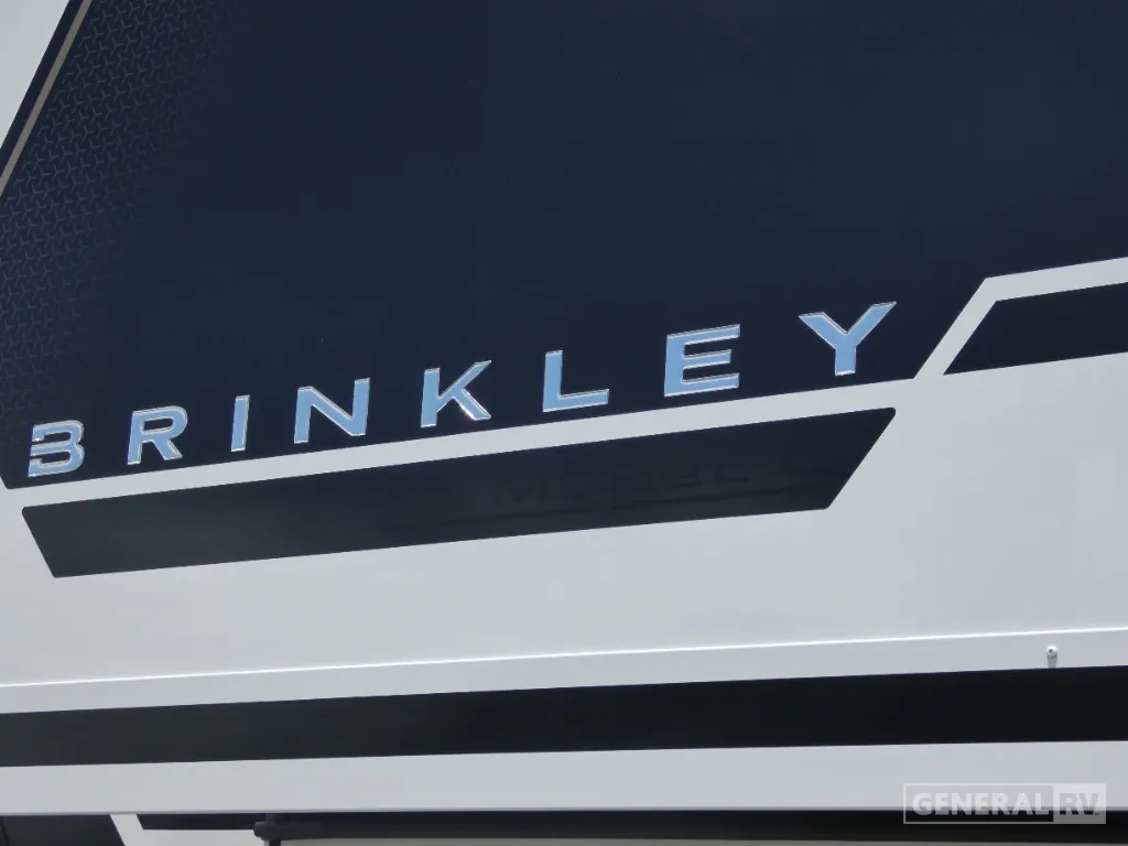 2026 Brinkley Model G 3250 — Close-up photograph visibly shows the RV's exterior wall graphics and Brinkley branding