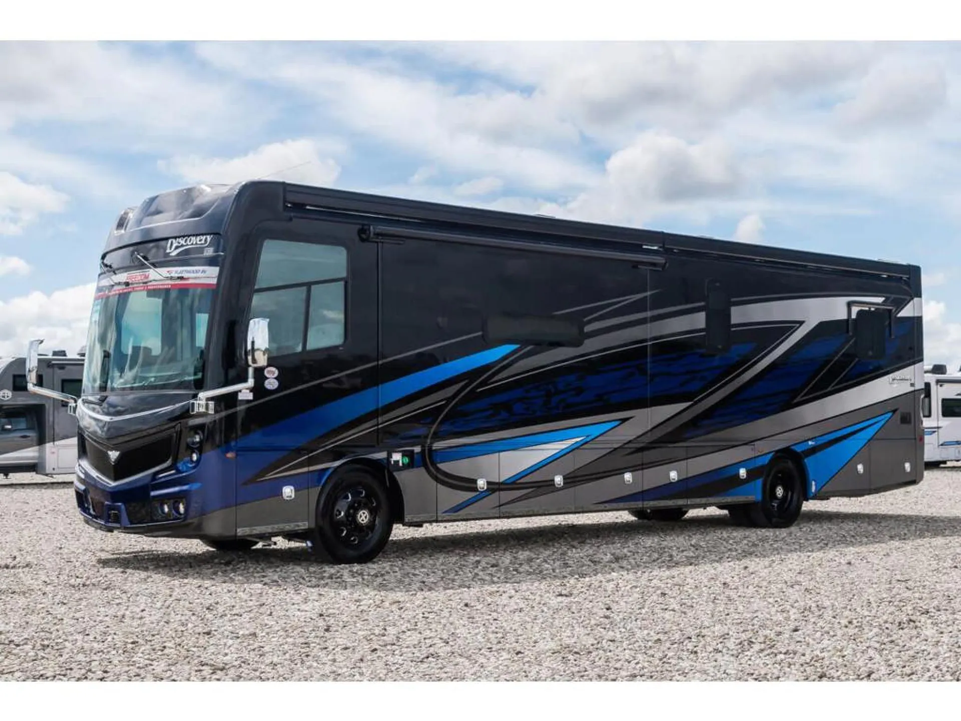 2026 Fleetwood Discovery LXE 40G — The complete exterior front-side of the motorhome