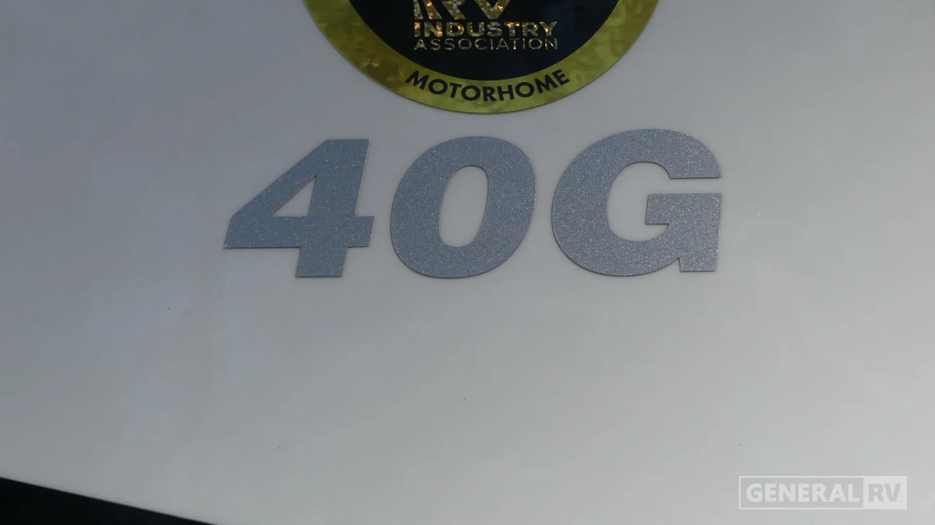 2026 Fleetwood Discovery LXE 40G — Visible 40G badge and motorhome association emblem are attached to the RV exterior
