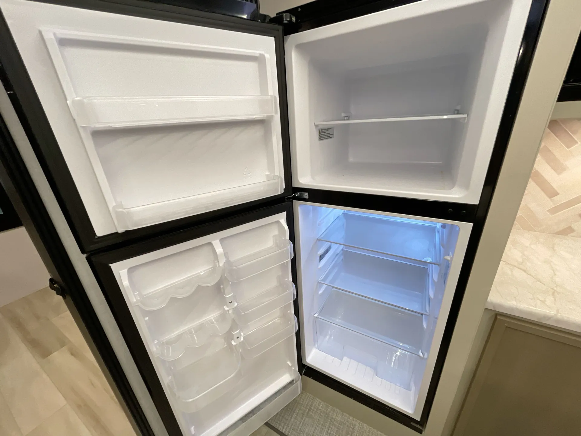 2027 Forest River Wildwood Heritage Glen 310BHI — fridge open