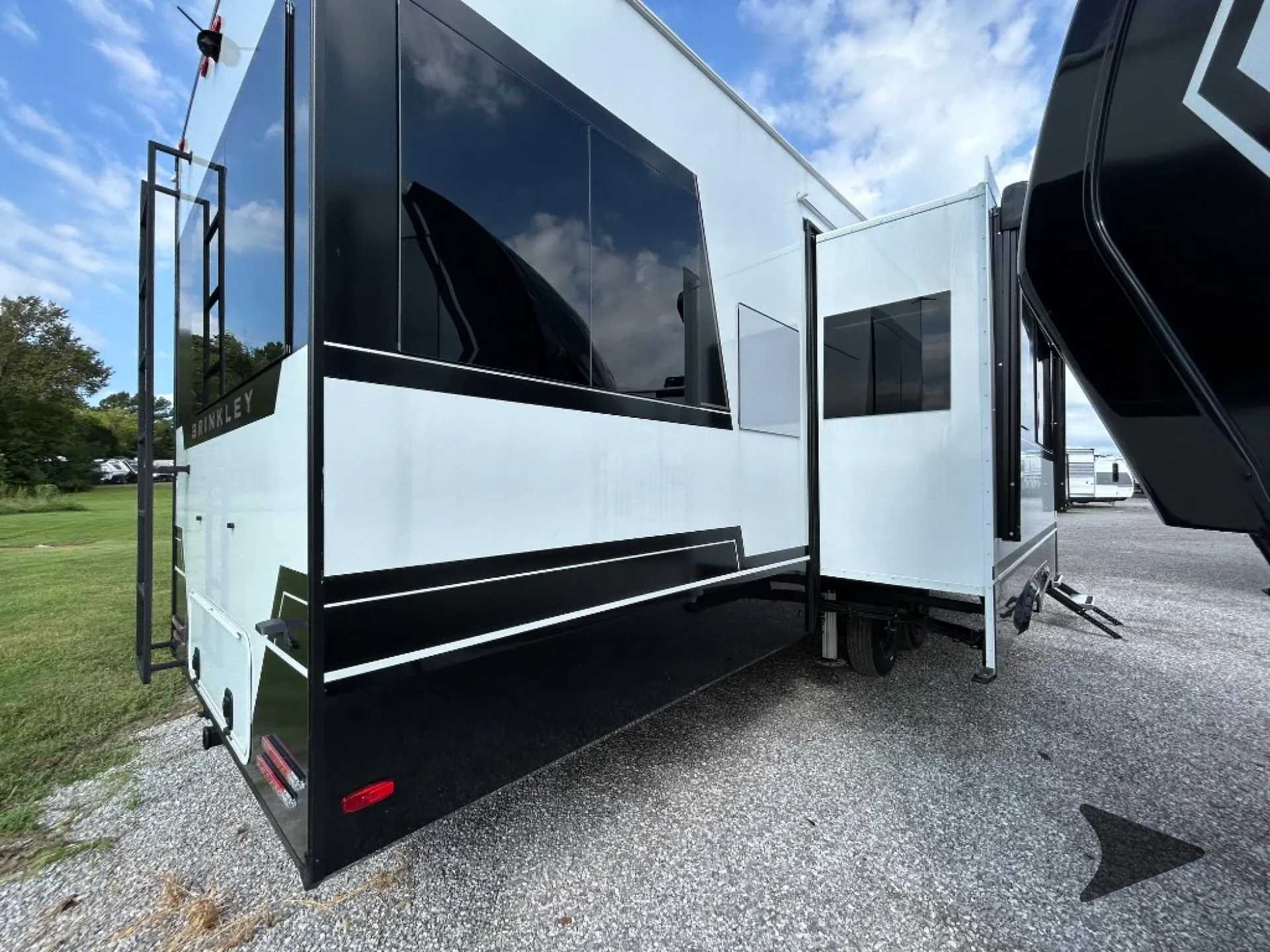 2026 Brinkley Model Z 3515 — The exterior rear/side shell of the RV with slide-out structures and exterior graphics