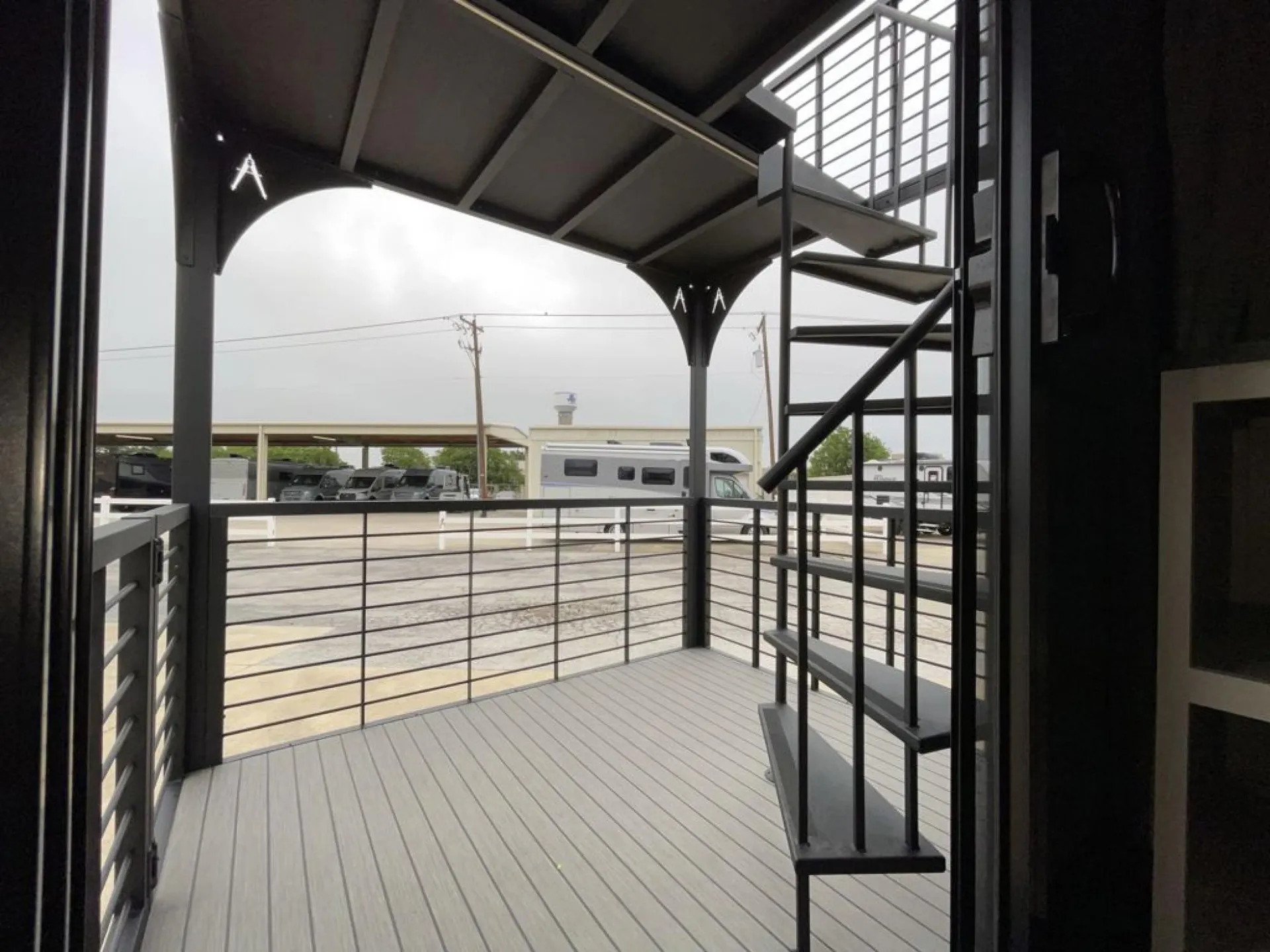 2026 Grand Design Foundation 42GD — Outdoor deck and spiral stairs attached to the RV are the primary visible features