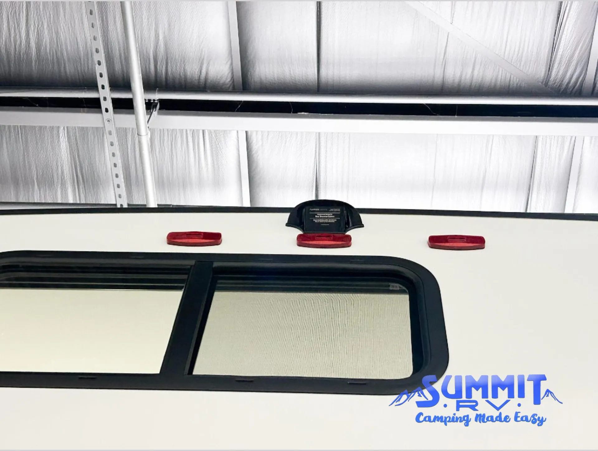 2027 Grand Design Reflection 362TBS — Exterior wall visibly shows RV window framing, marker lights, and an exterior-mounted component