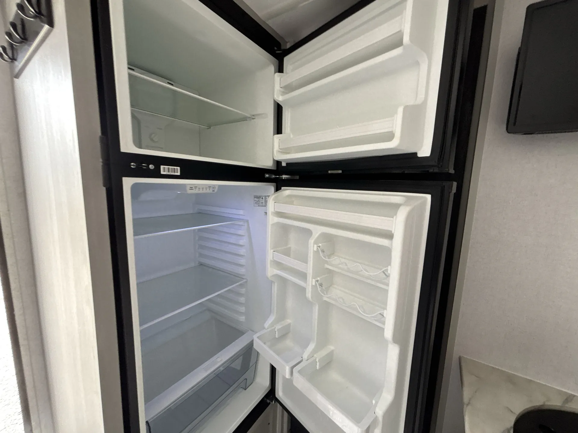 2022 Forest River Wildwood FSX 169RSK — fridge open