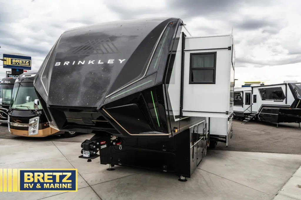 2026 Brinkley Model G 3950 — The front exterior, fifth-wheel hitch, front cap, and side slide-out