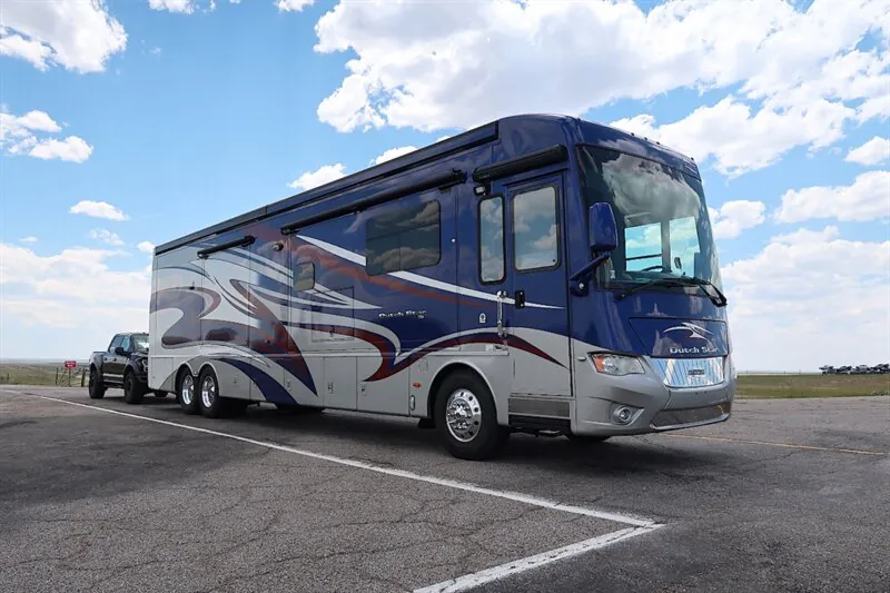 2016 Newmar Dutch Star 4369 — Photograph clearly shows the complete exterior front and side of a Dutch Star motorhome